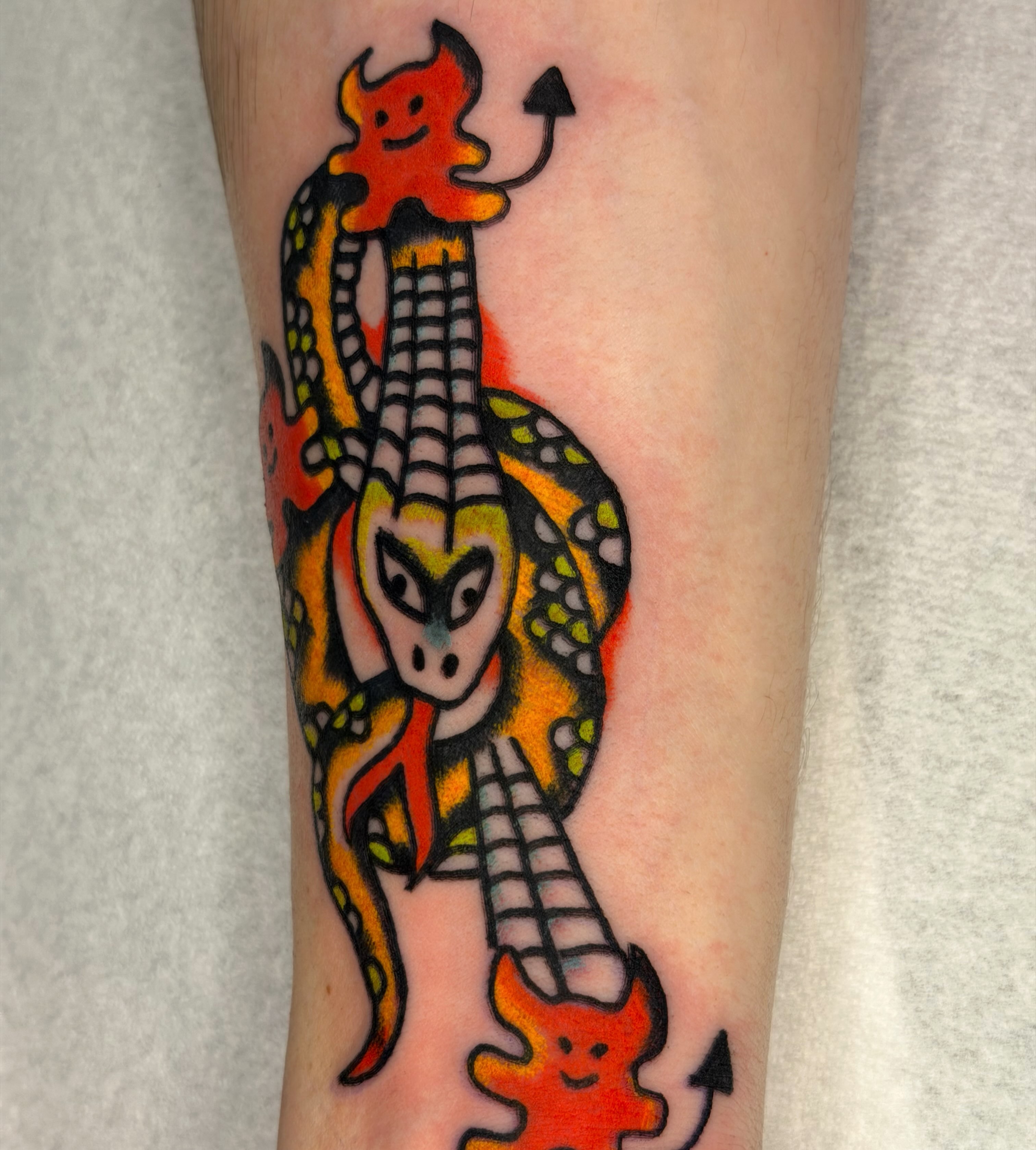 Snake American traditional tattoo on the forearm by Jake