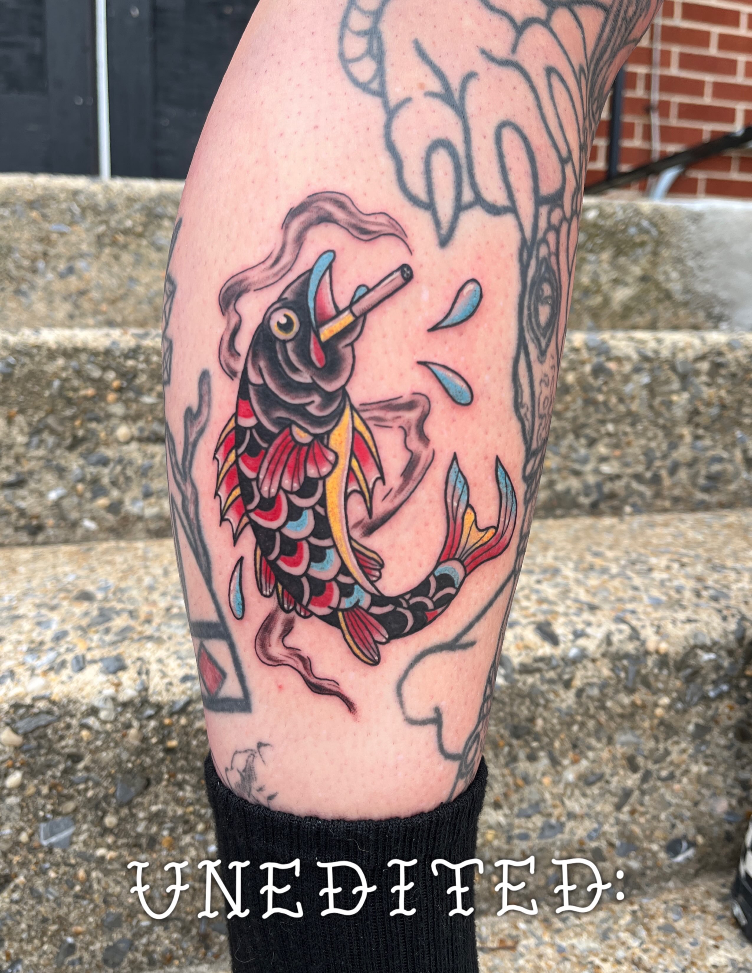 Koi fish American traditional tattoo on the forearm by sarah