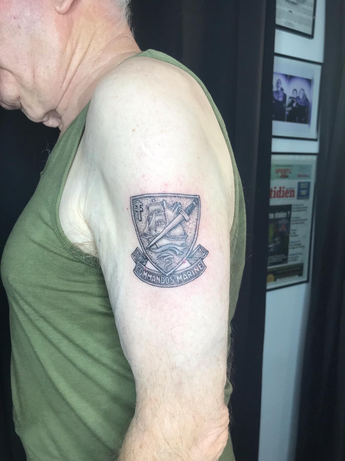 Maritime emblem black and grey tattoo on the shoulder by Moss Quito Tattoo