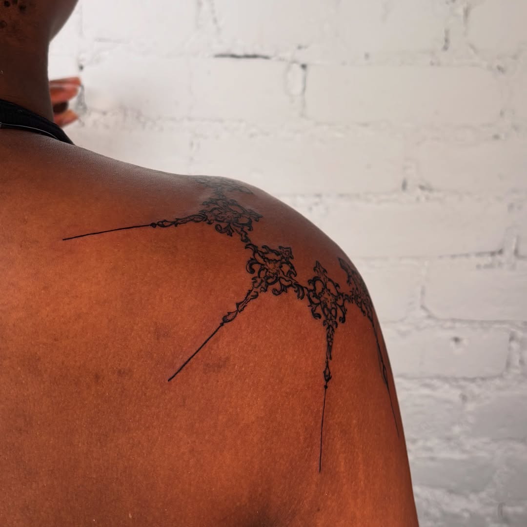 Lace pattern ornamental tattoo on the shoulder by laura bianca
