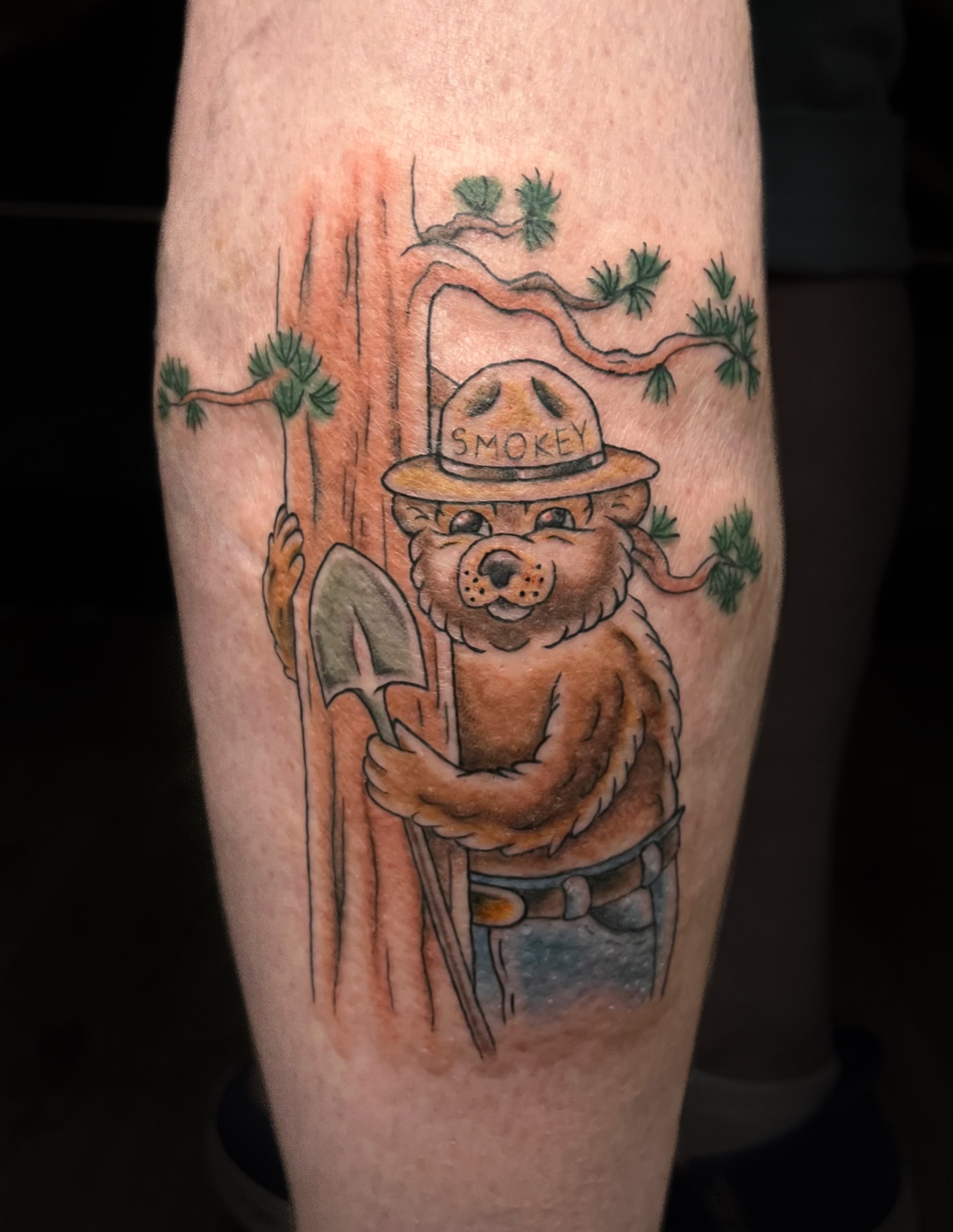 Smokey bear American traditional tattoo on the forearm by Chase Healey, Salt Lake City, Utah