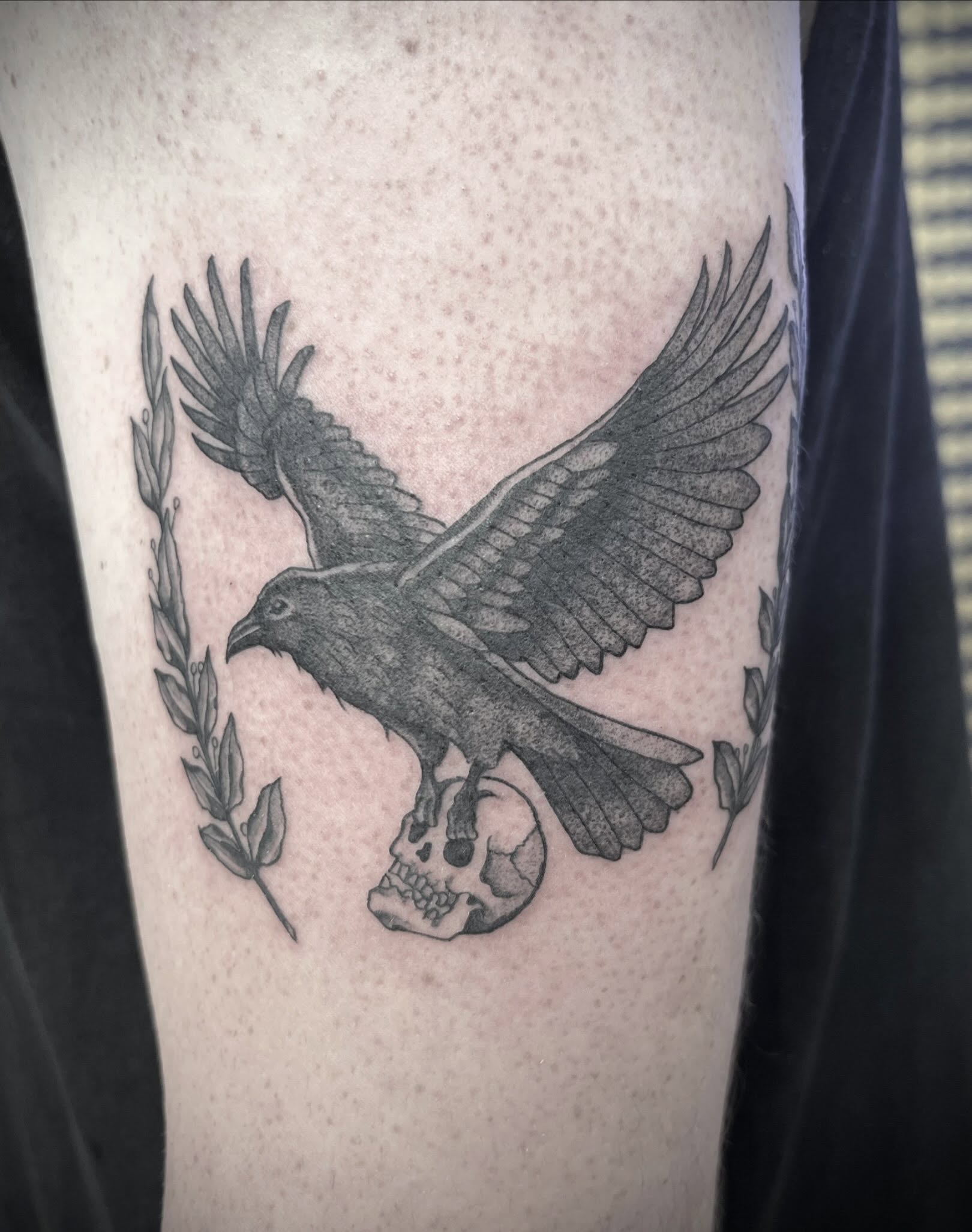 Raven and skull black and grey tattoo on the forearm by Natalie Phillips, Oakland, California
