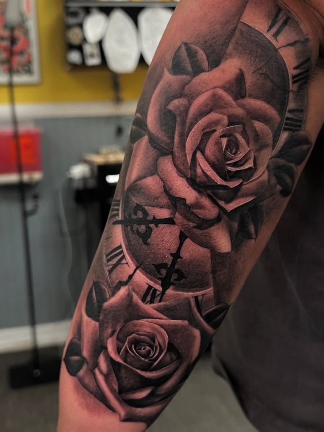 Roses and clock realism tattoo on the forearm by Vondrae