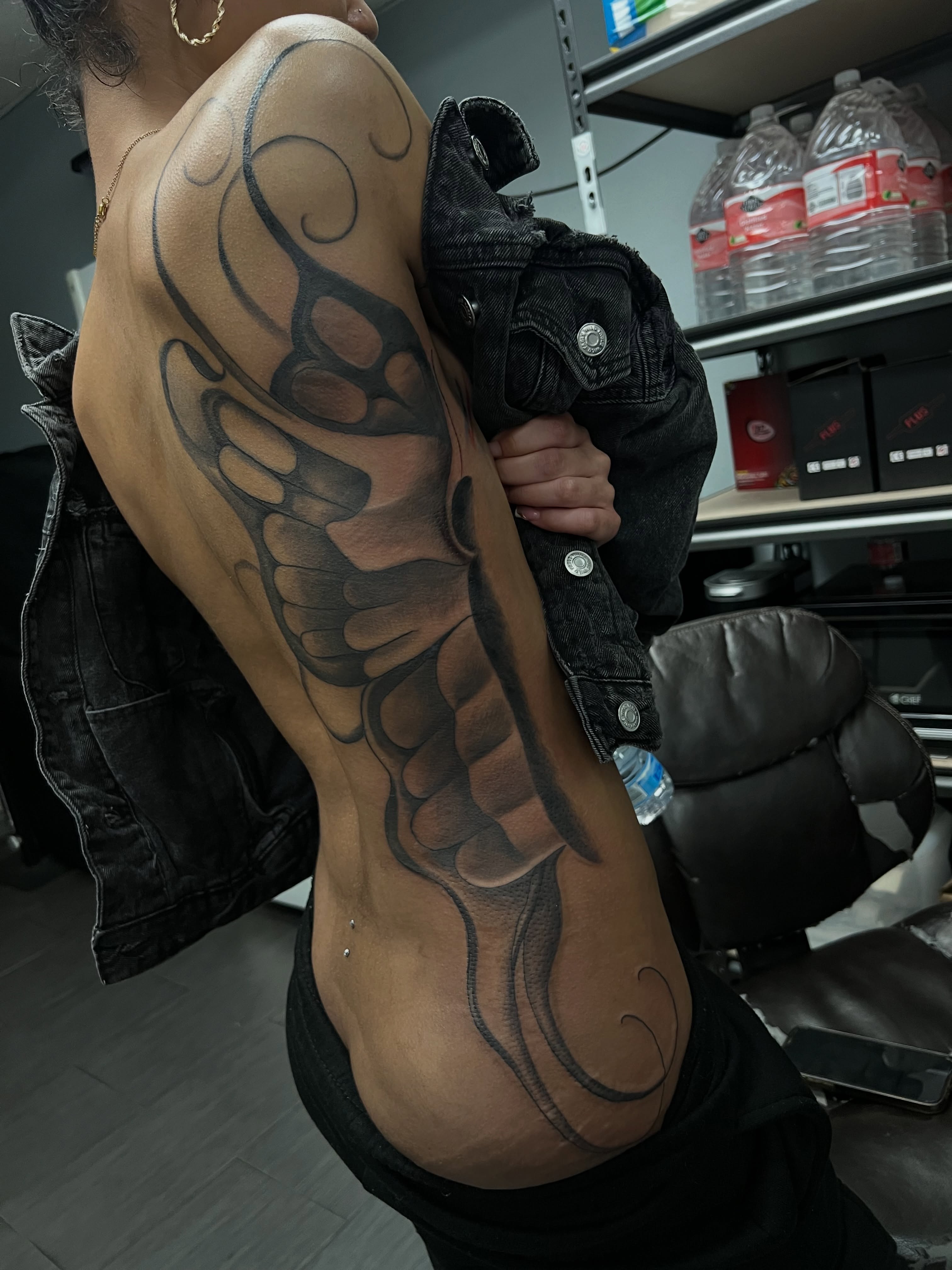 Wing black and grey tattoo on the upper arm by Vondrae