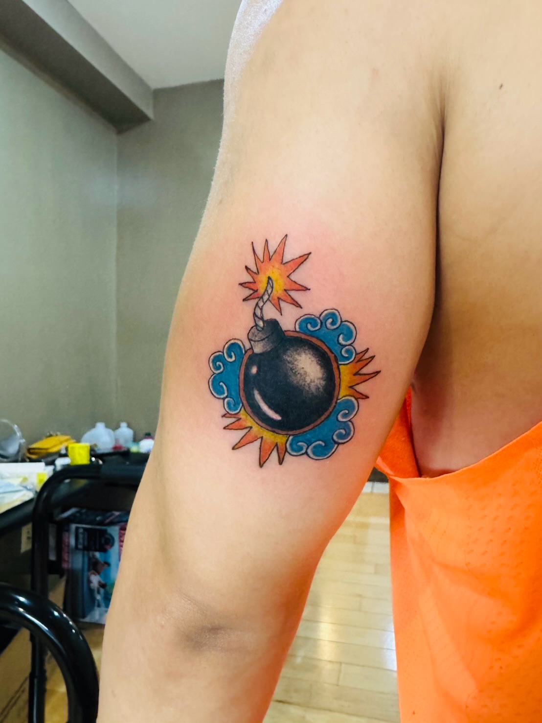 Bomb neo-traditional tattoo on the forearm by Ink Napawong
