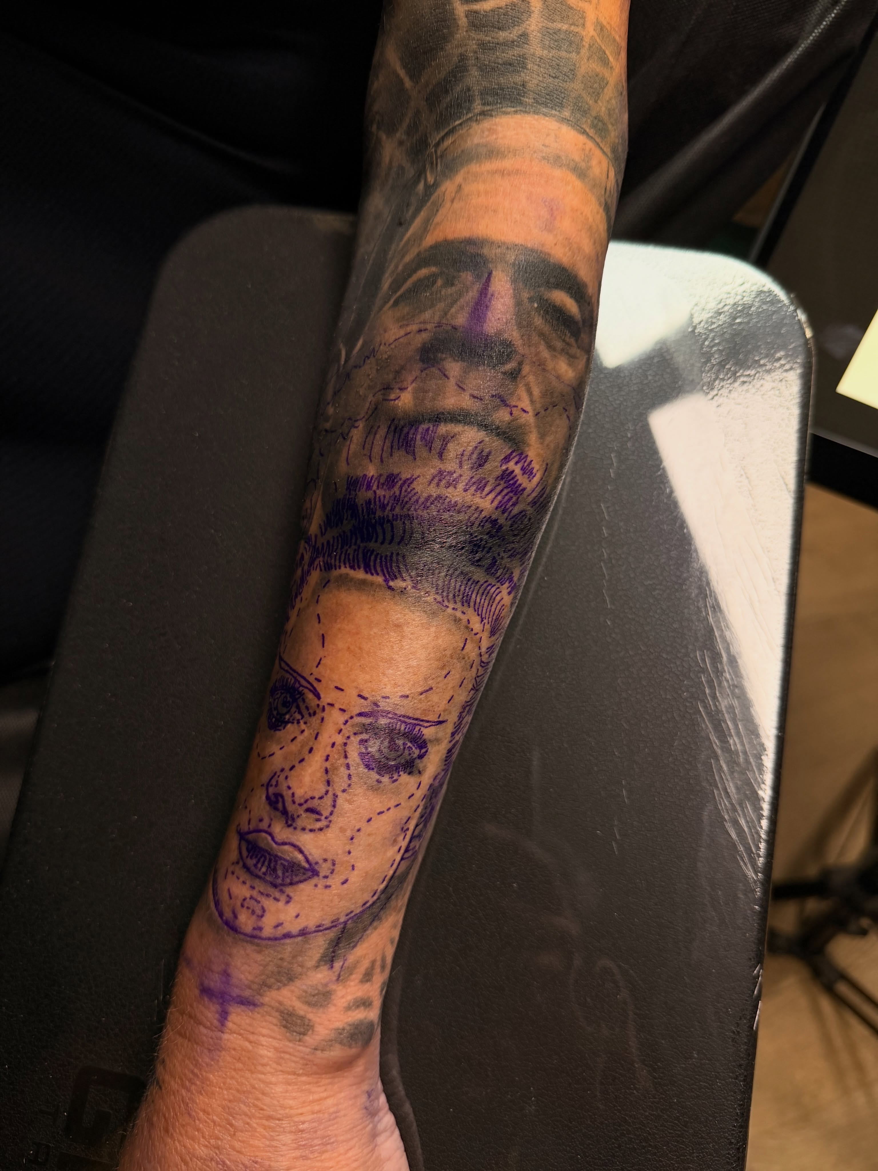 Portrait realism tattoo on the forearm by Robert Graye