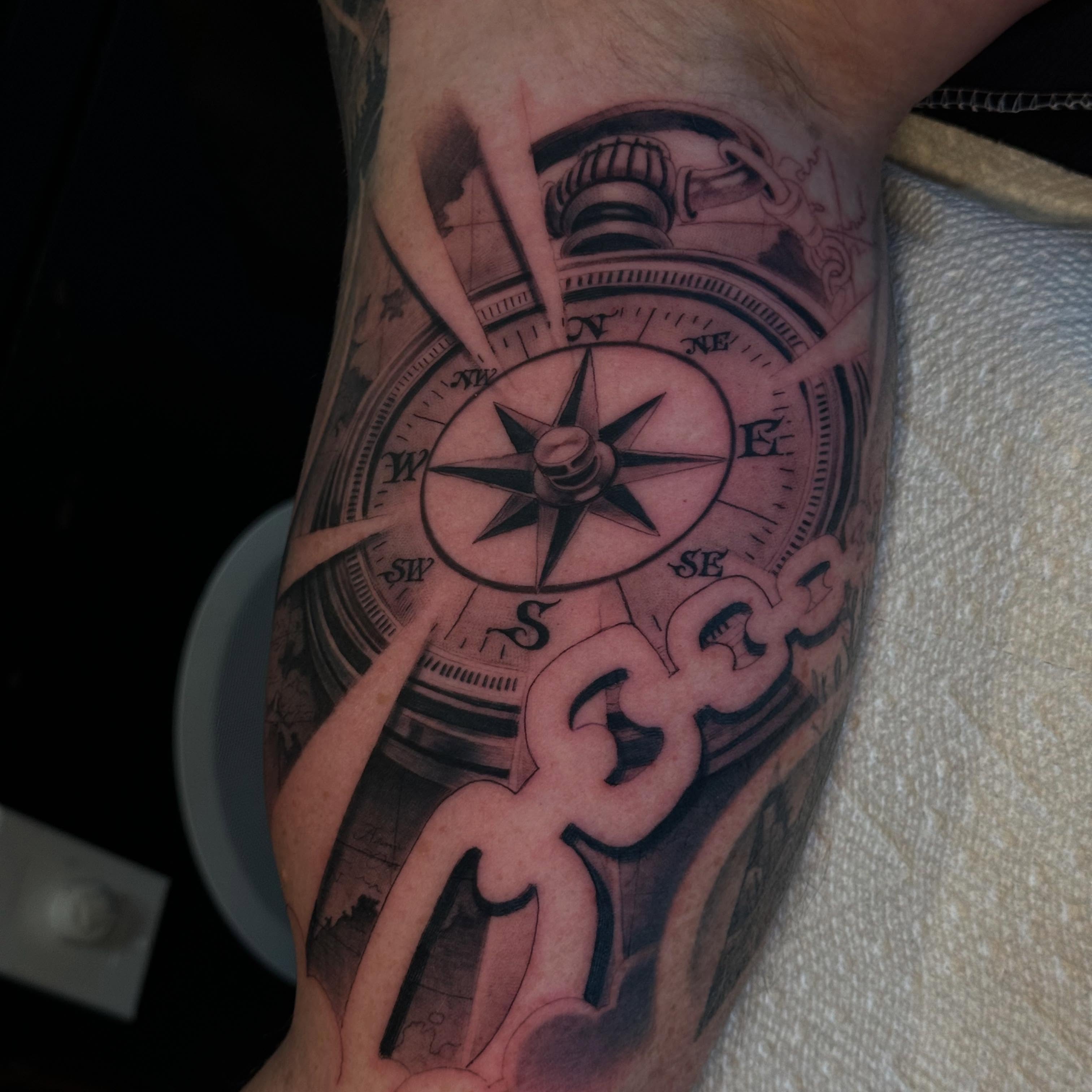 Compass realism tattoo on the forearm by Evan Wyatt