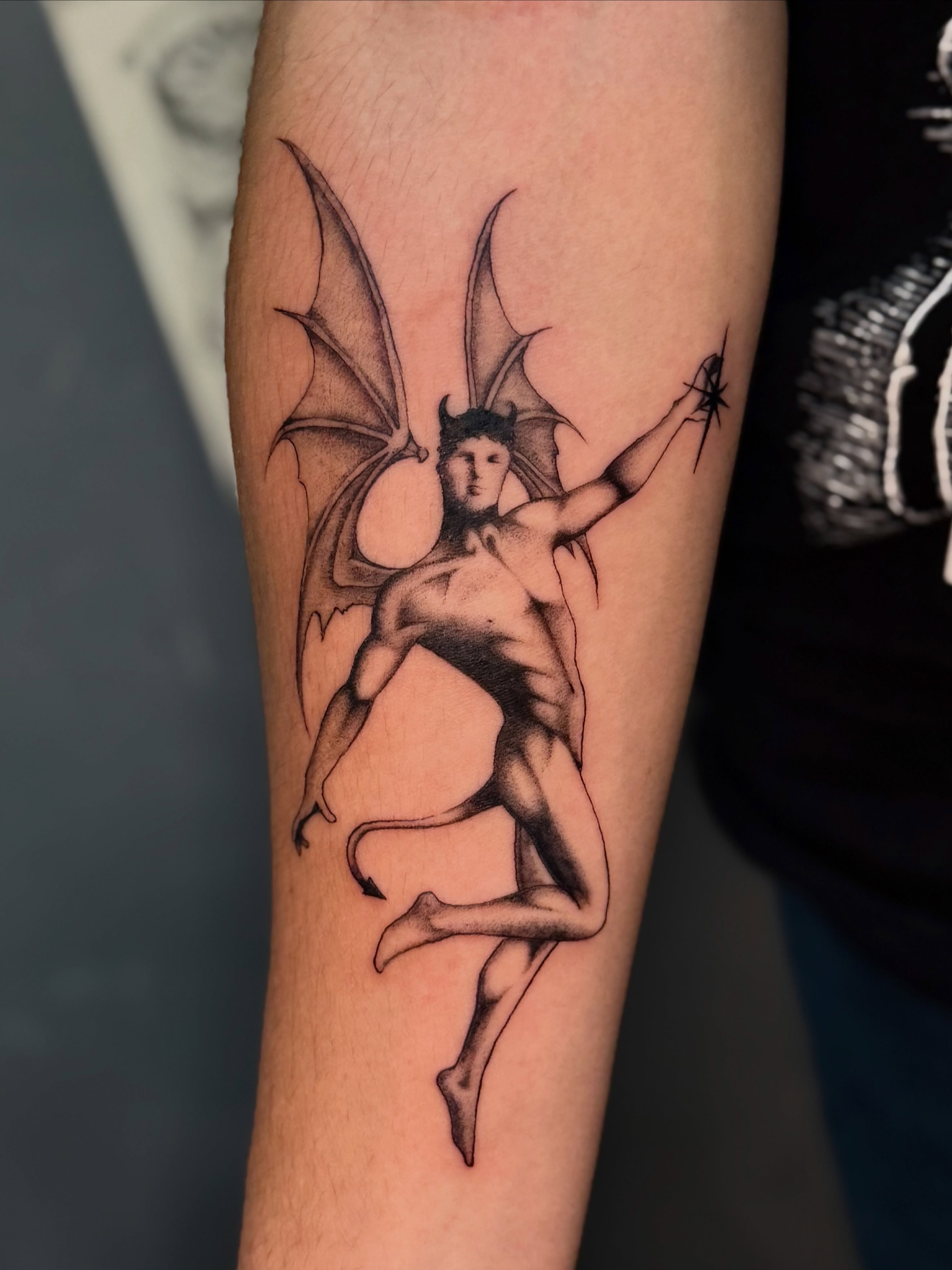 Winged figure black and grey tattoo on the forearm by ༺♡༻ Melia’s Dolls ༺♡༻