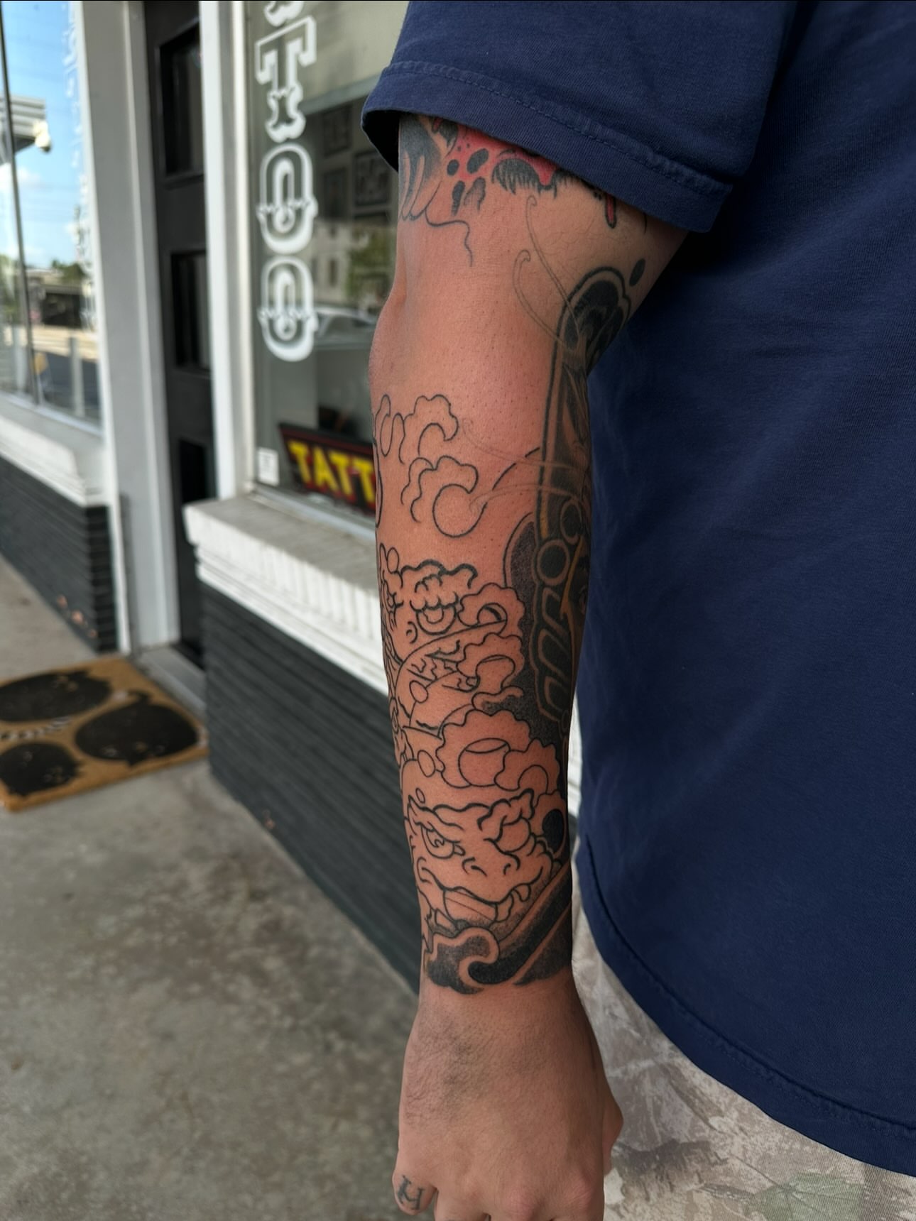 Dragon and clouds japanese irezumi tattoo on the forearm by Logan Perry