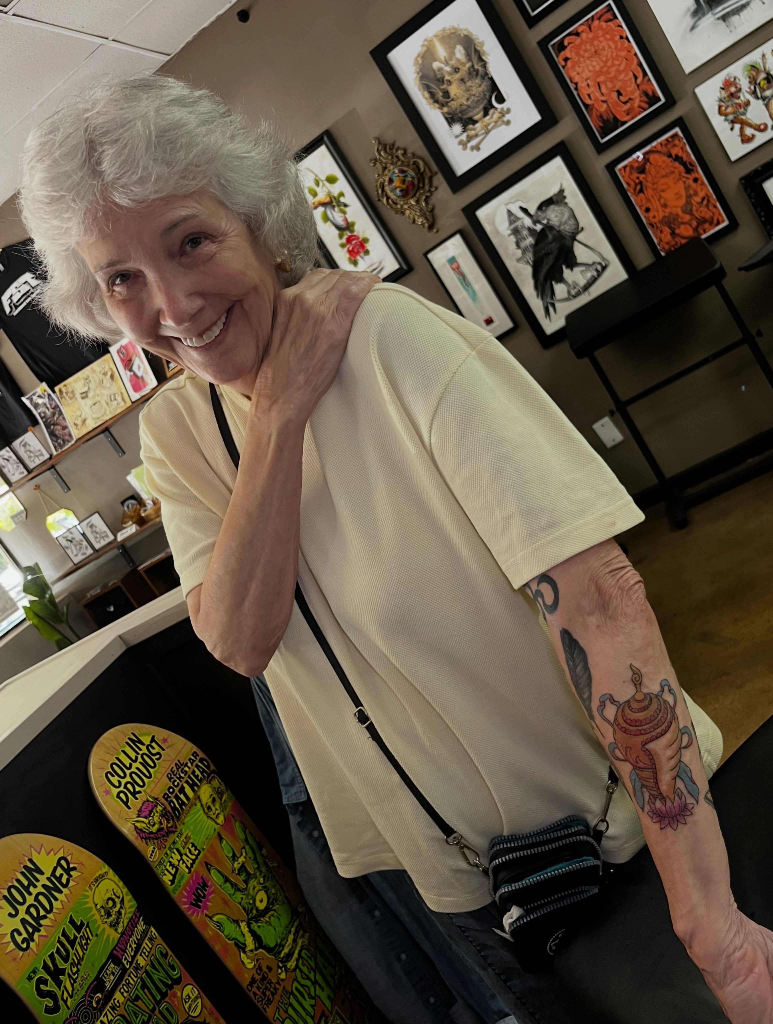 Tattooed arm black and grey tattoo on the upper arm by Evan Perrine