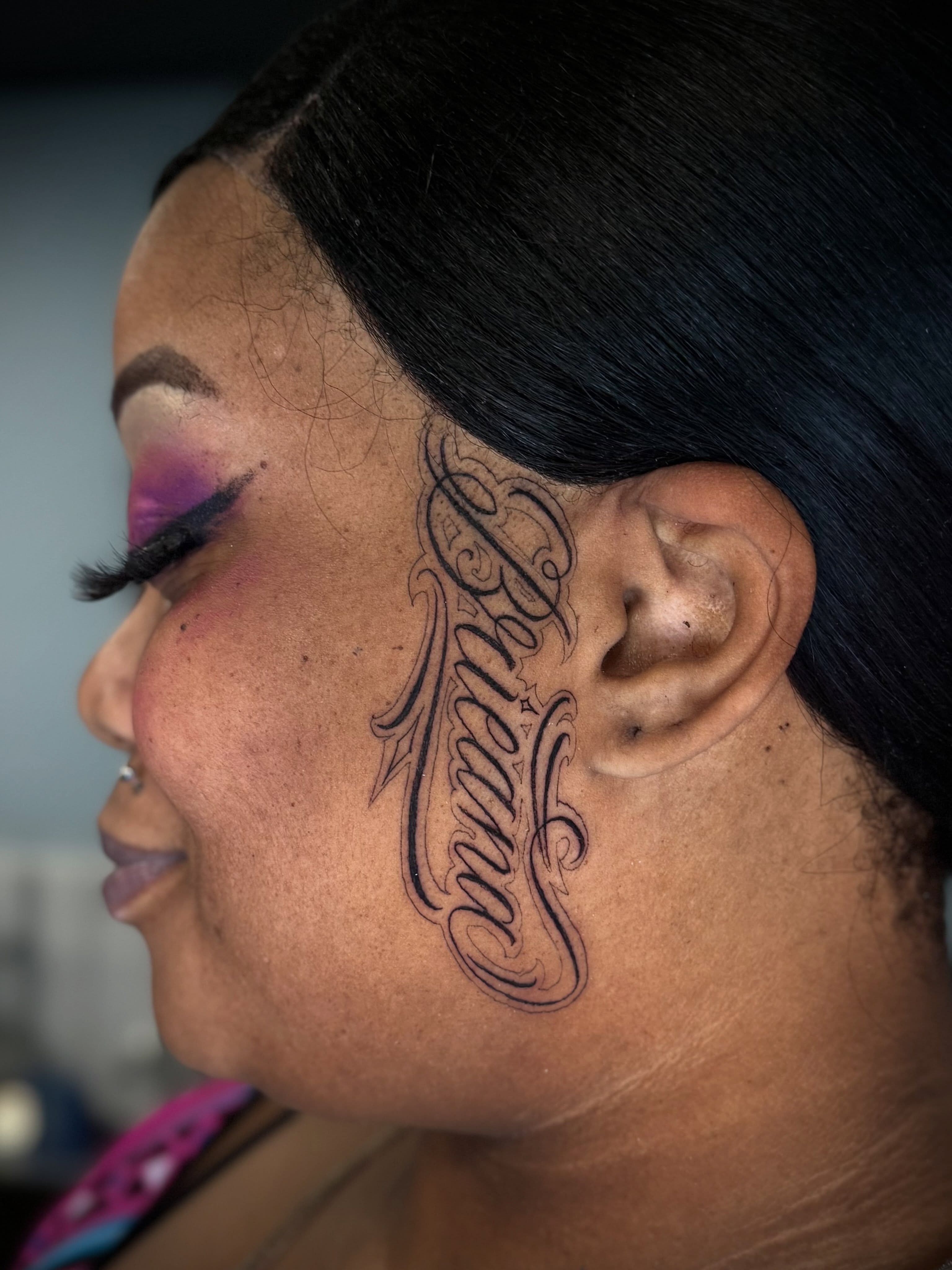 Script lettering lettering script tattoo on the neck by Stilow Memphis Tattoo Artist, Memphis, Tennessee
