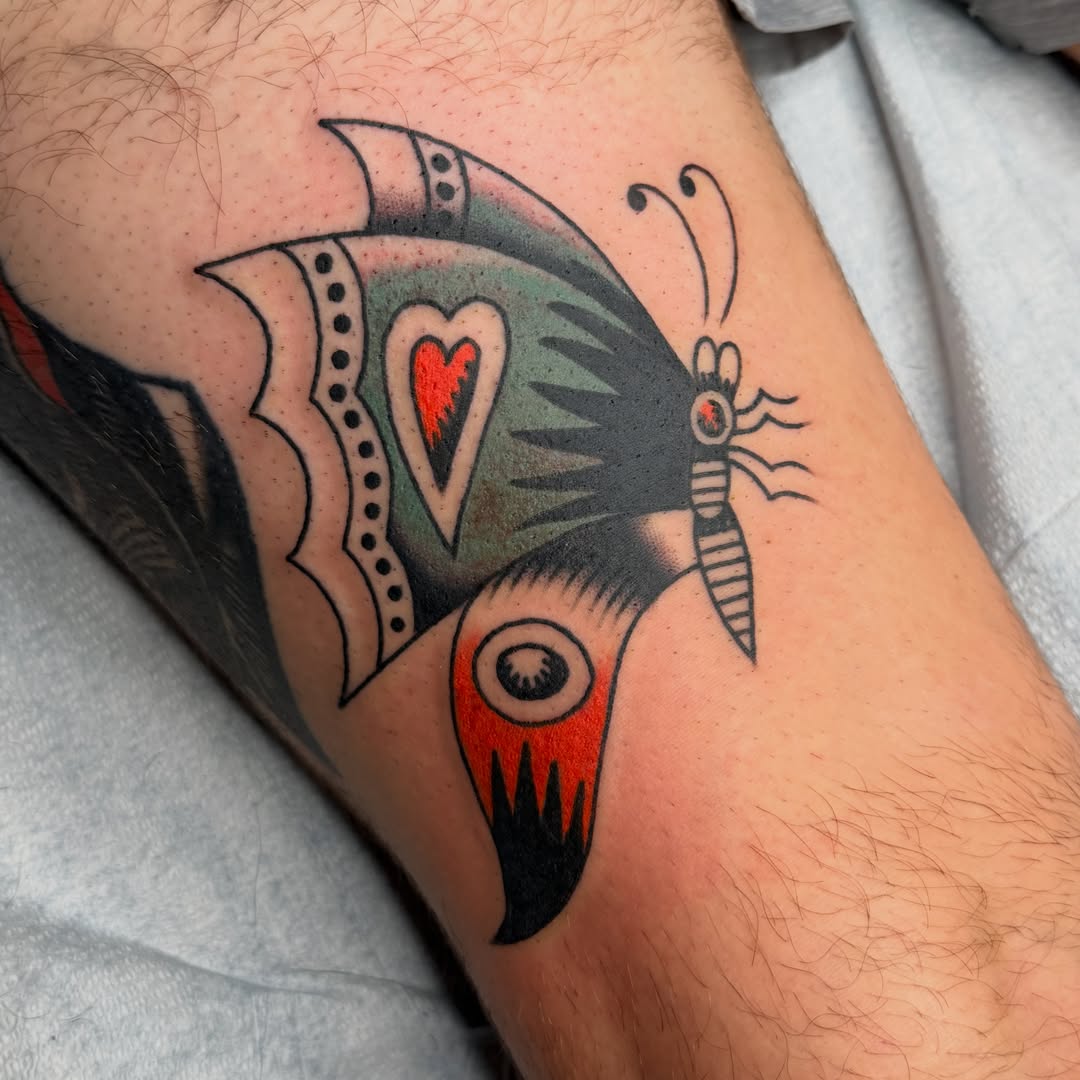 Butterfly and dragonfly American traditional tattoo on the forearm by Andrew Storm