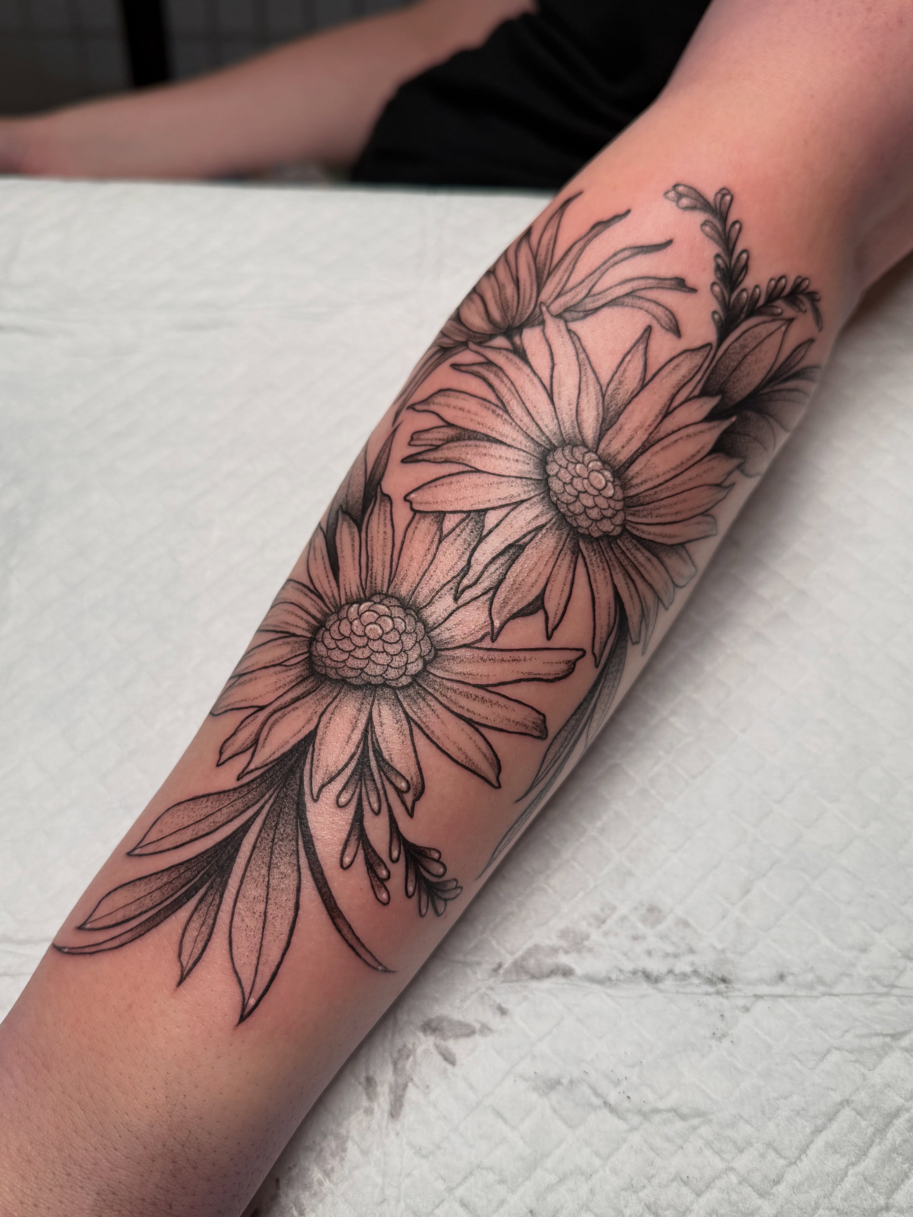 Daisies black and grey tattoo on the forearm by ✨Syreena✨