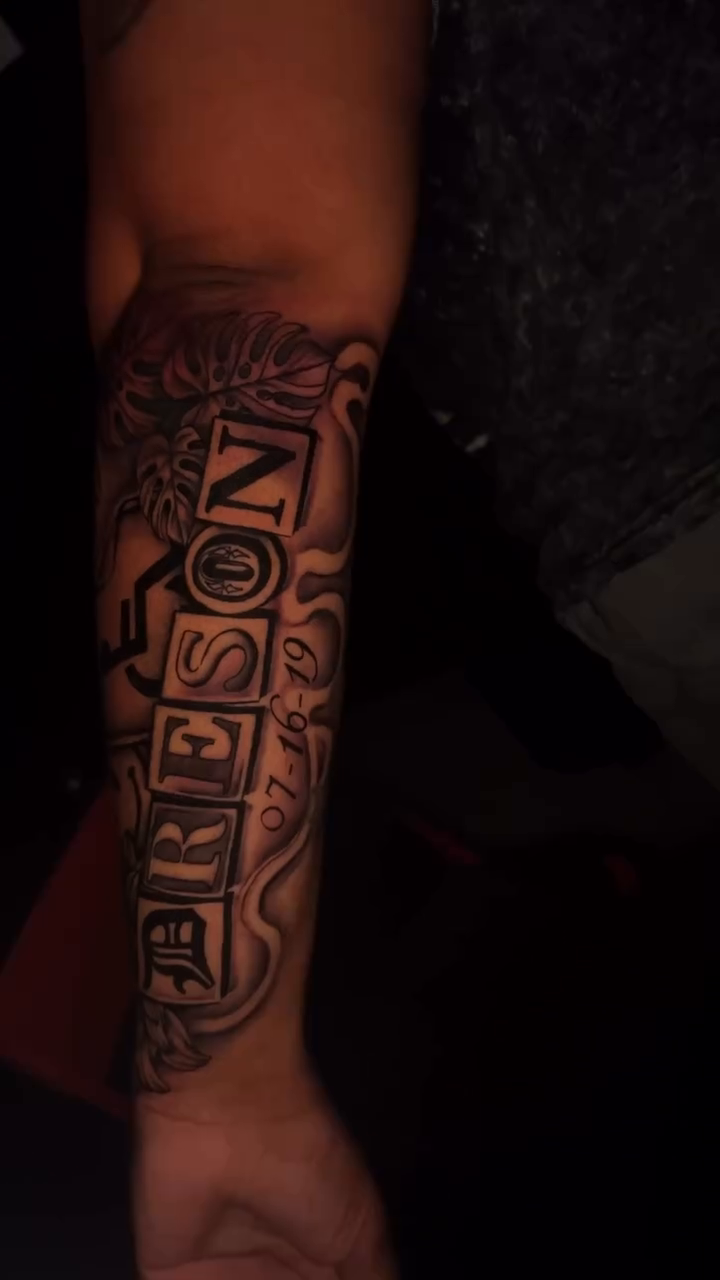 Tattoo by @redinkdtattoos — lettering_script, black_and_grey