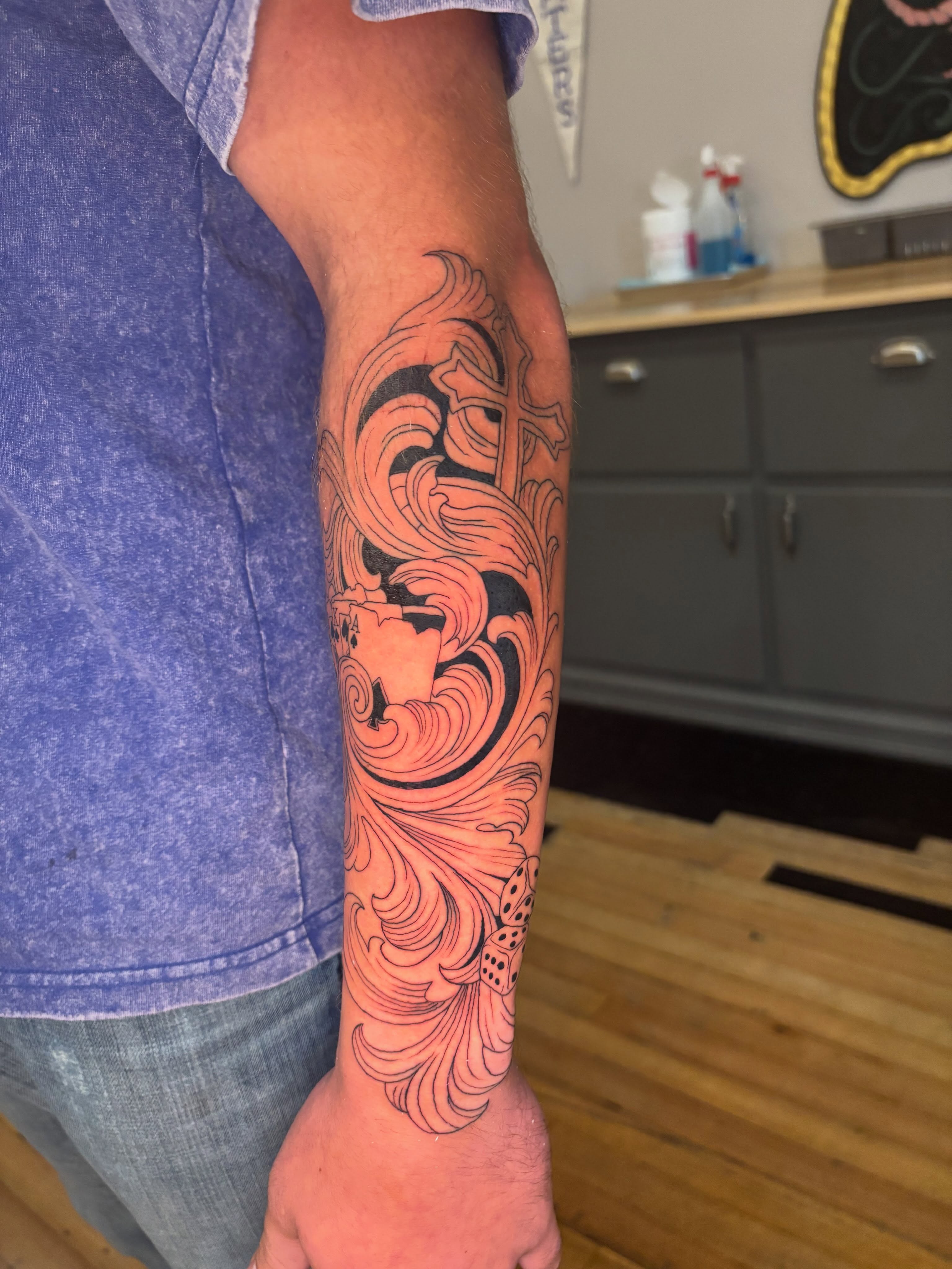 Bearded man black and grey tattoo on the forearm by Aubri Aunna