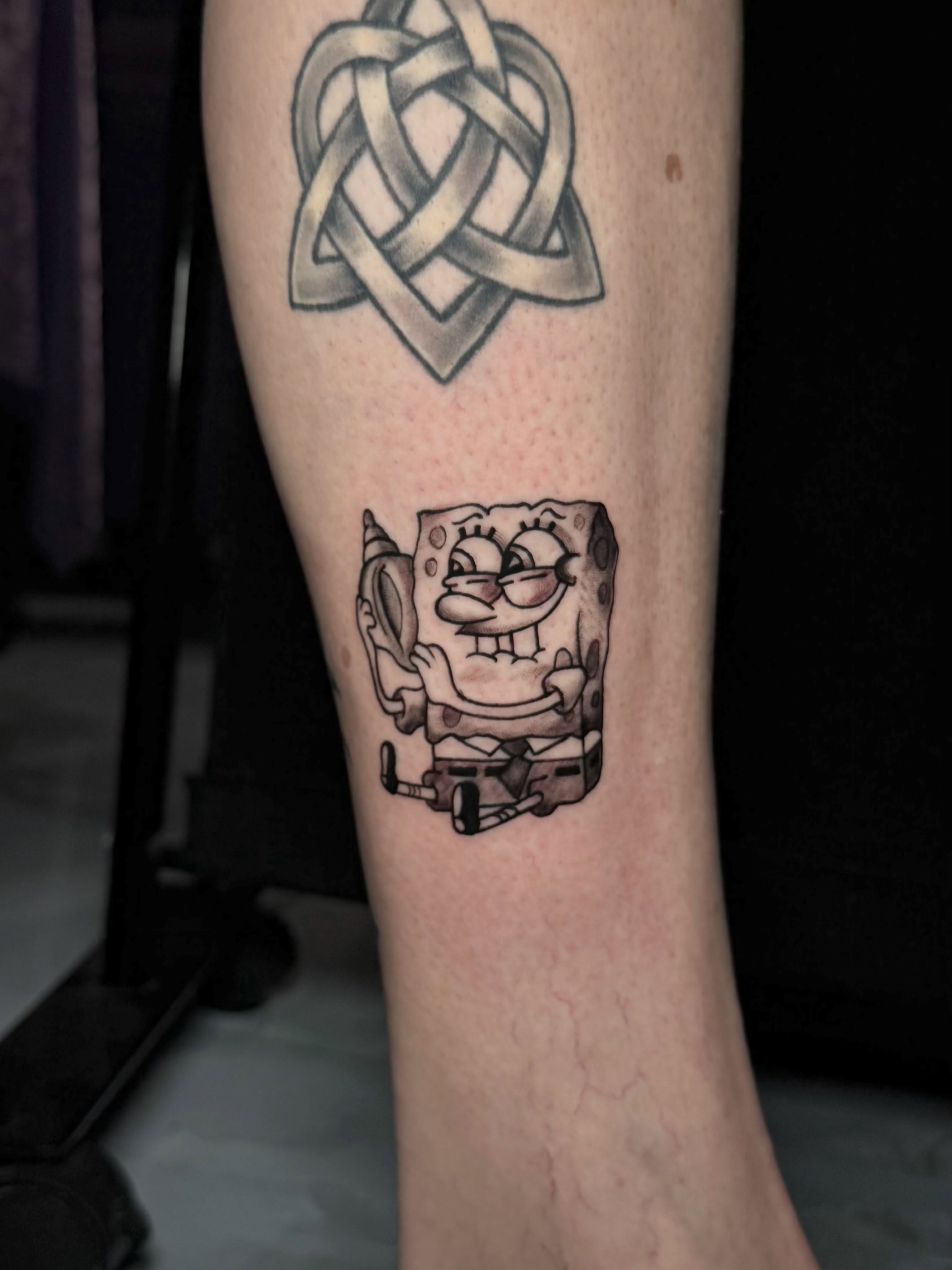Spongebob squarepants black and grey tattoo on the forearm by Exis LHinc, Miami, Florida