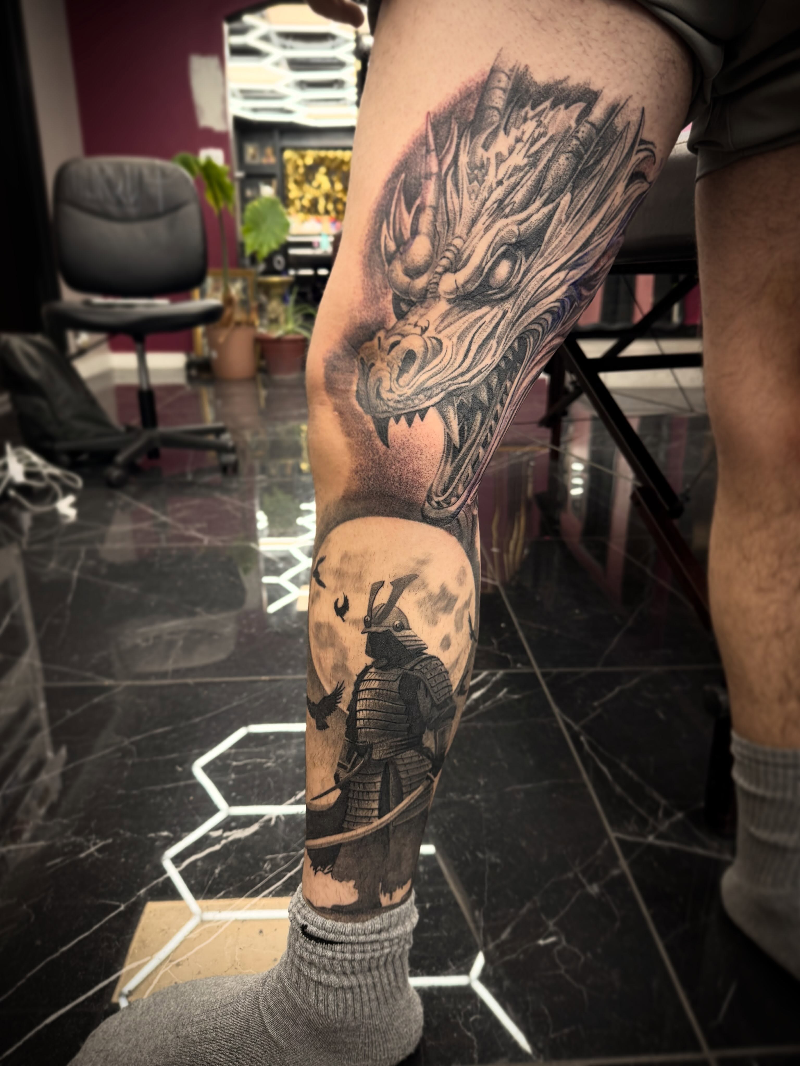 Dragon and samurai realism tattoo on the thigh by Mark Phillip Chavez