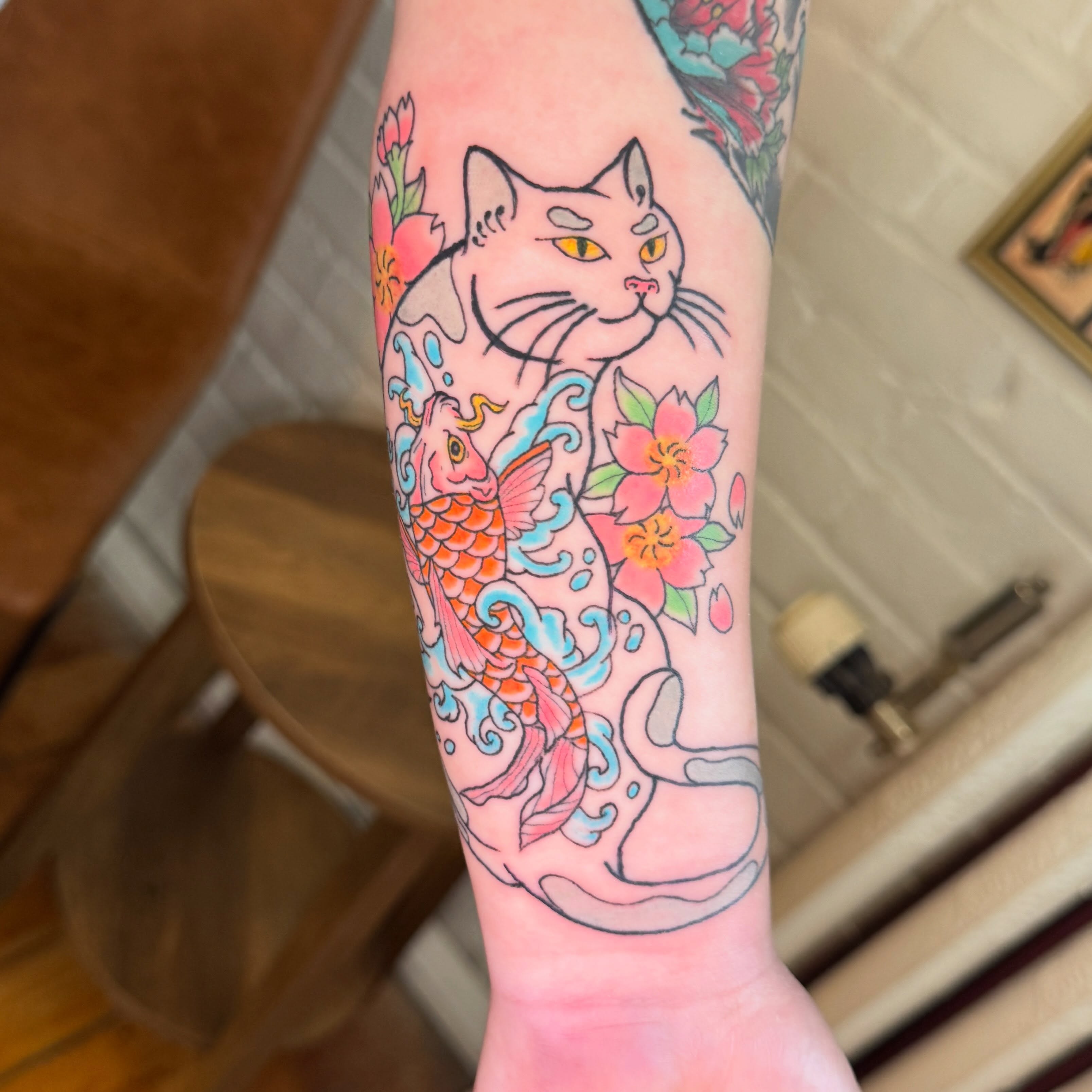 Cat and koi fish japanese irezumi tattoo on the forearm by Zac Smith-Chevalier