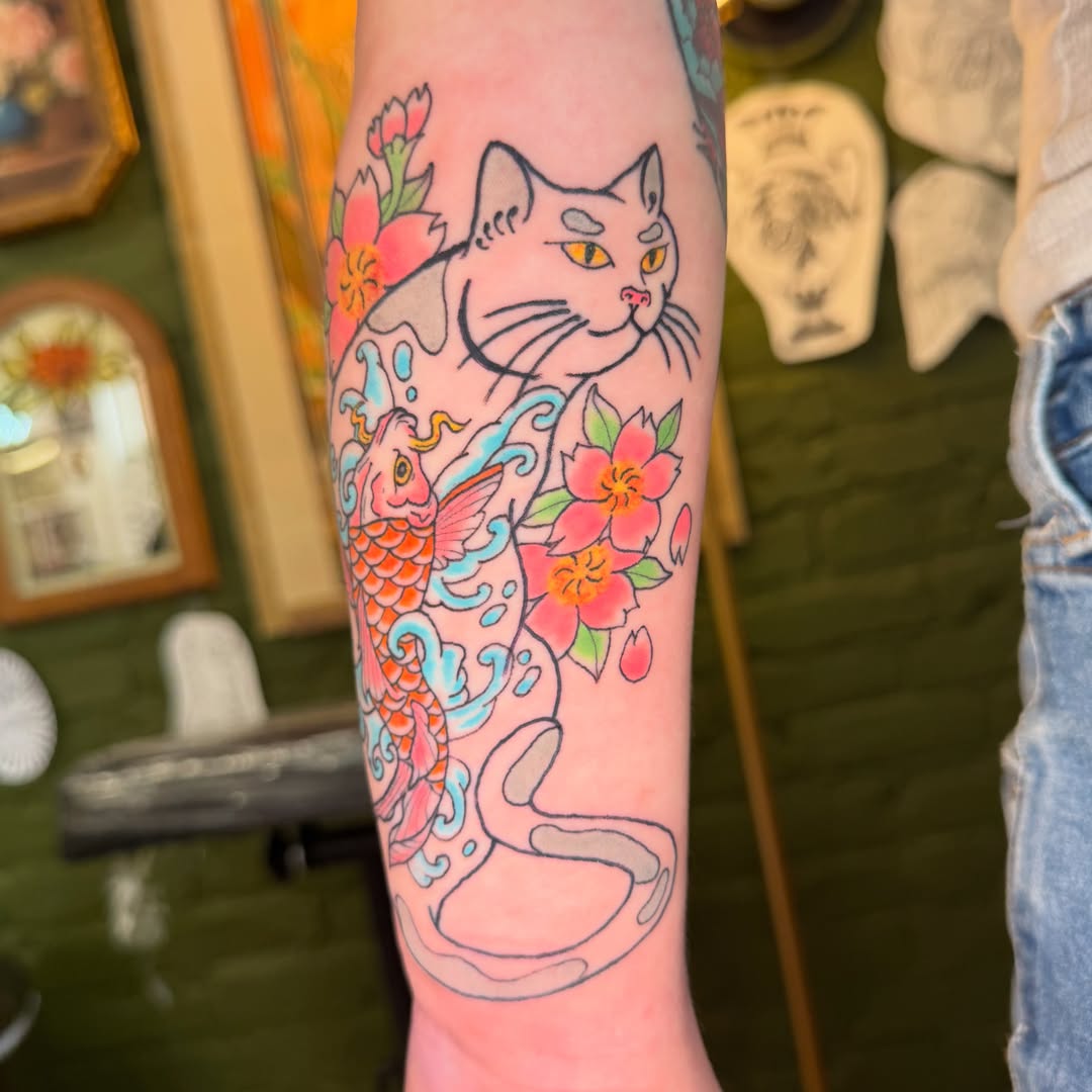 Cat and koi fish japanese irezumi tattoo on the forearm by Zac Smith-Chevalier
