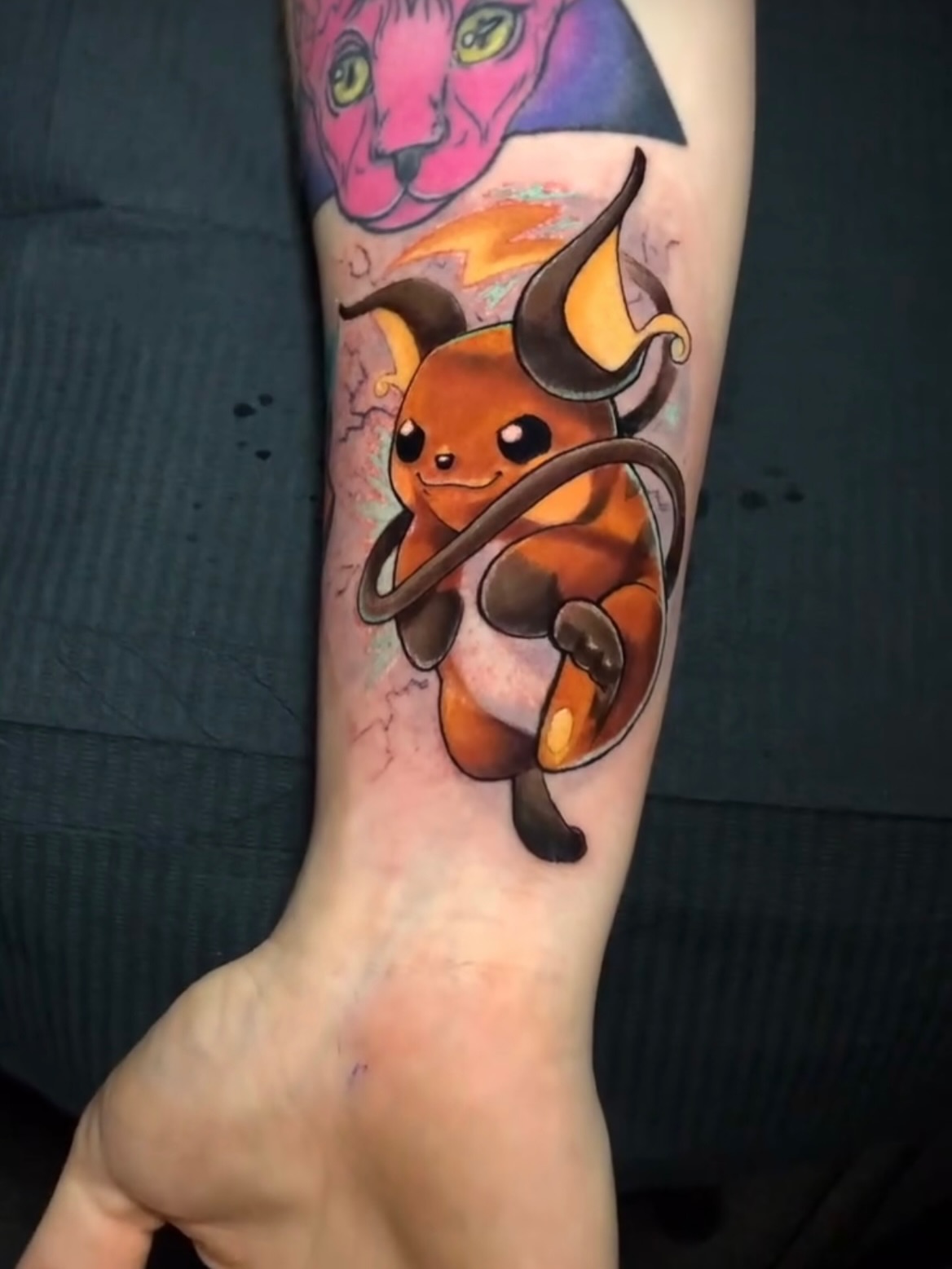 Raichu anime tattoo on the forearm by Frank Miller