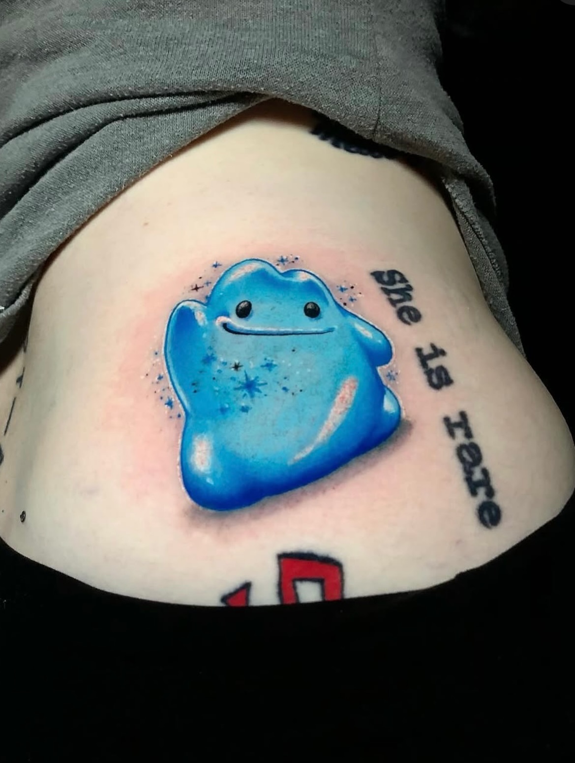 Blue ghost dotwork tattoo on the ribs by Frank Miller