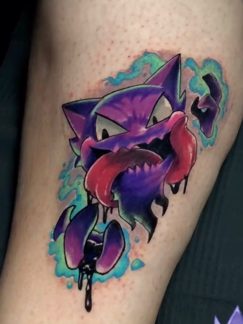 Gengar watercolor tattoo on the thigh by Frank Miller