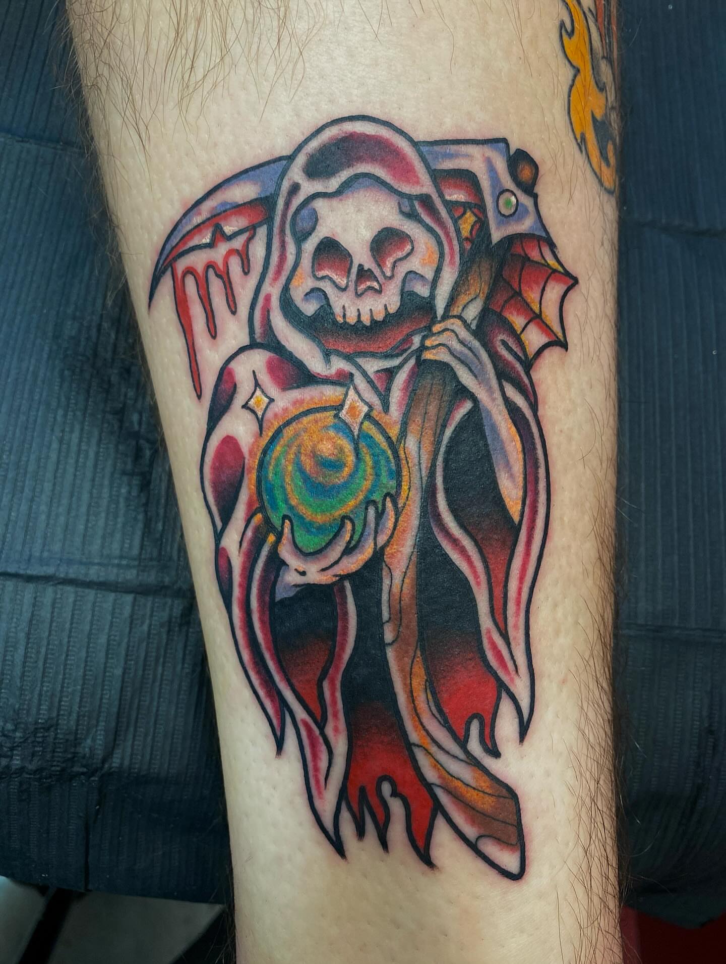 Skeleton holding orb American traditional tattoo on the forearm by Jonah