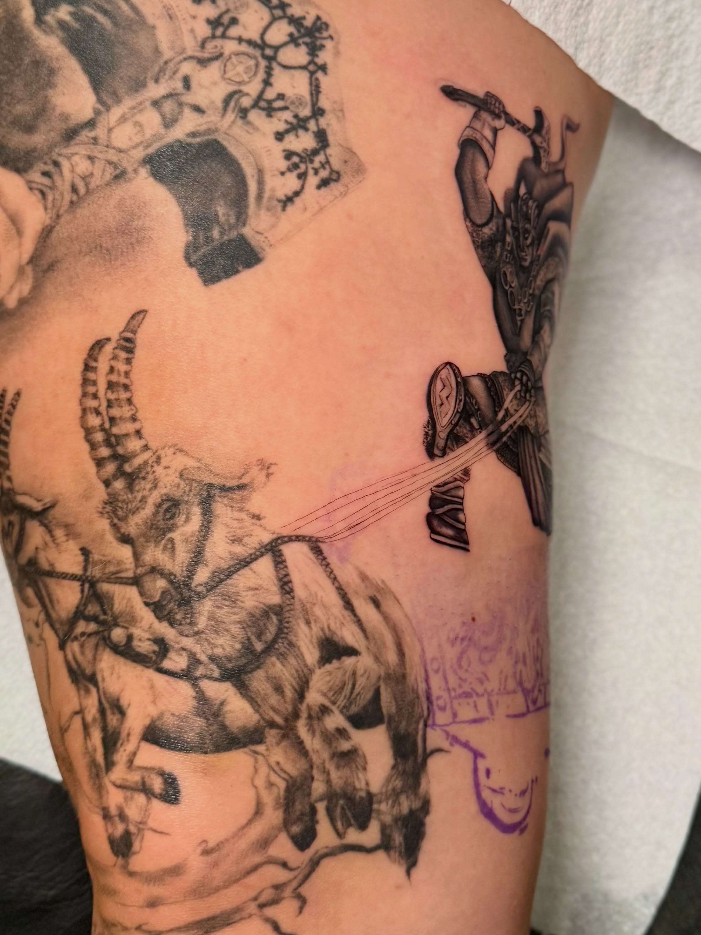 Bull rider realism tattoo on the upper arm by Tatum