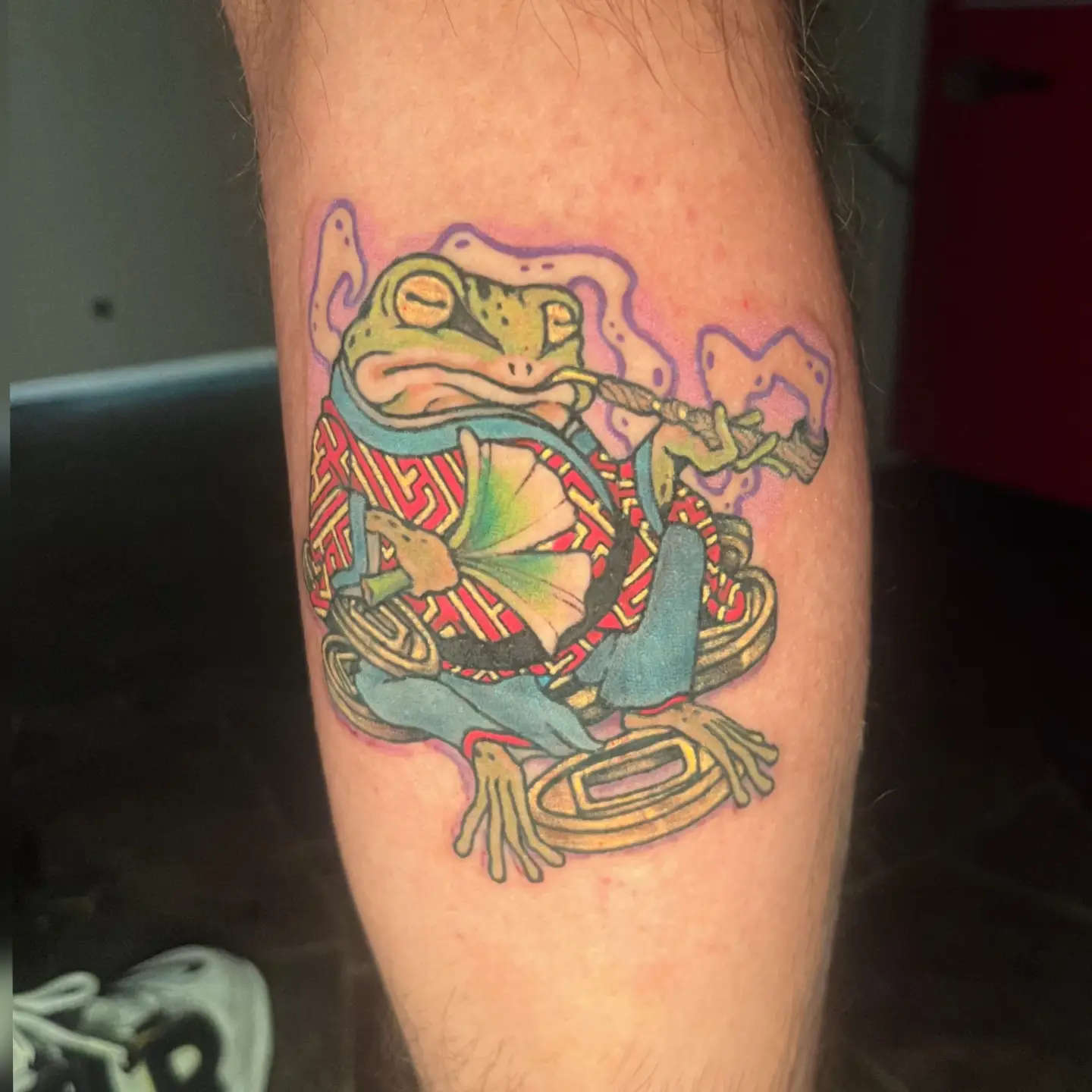 Frog new school tattoo on the forearm by Nason Dilts