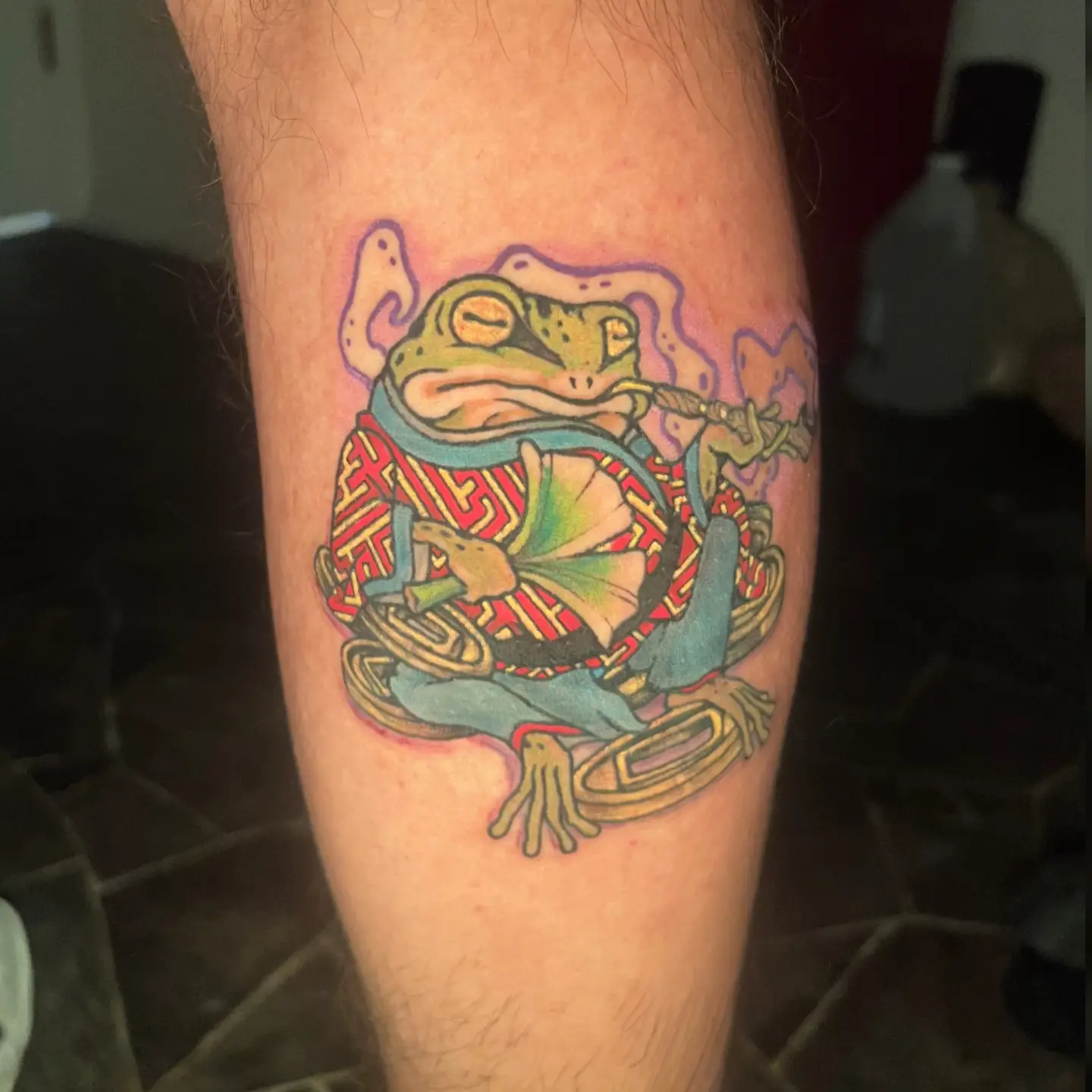 Frog new school tattoo on the forearm by Nason Dilts