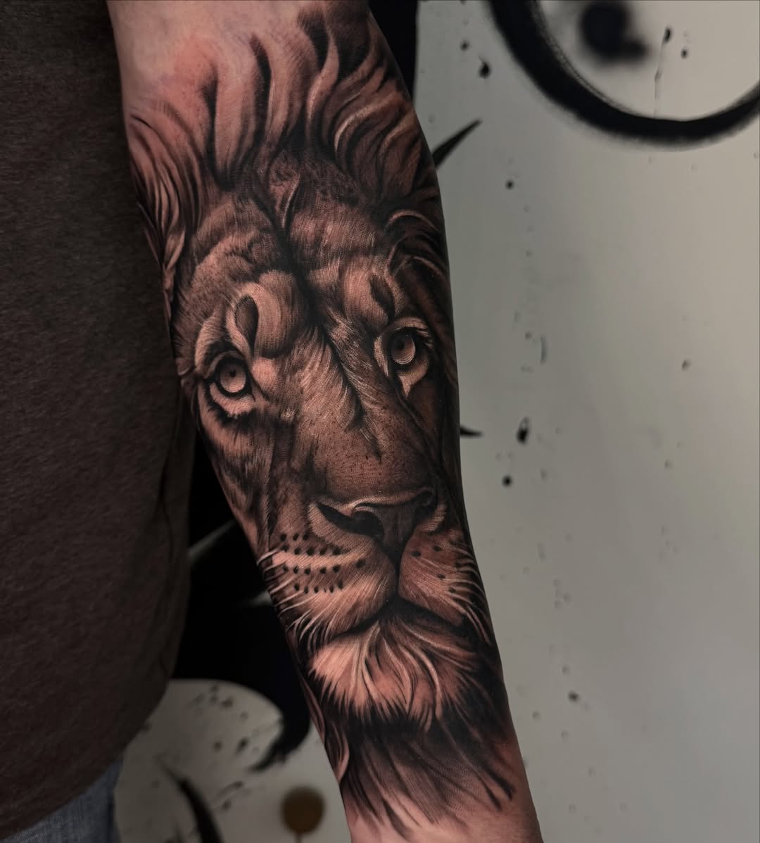 Lion realism tattoo on the forearm by Bryan ๐ฅ Loggins, Baton Rouge, Louisiana
