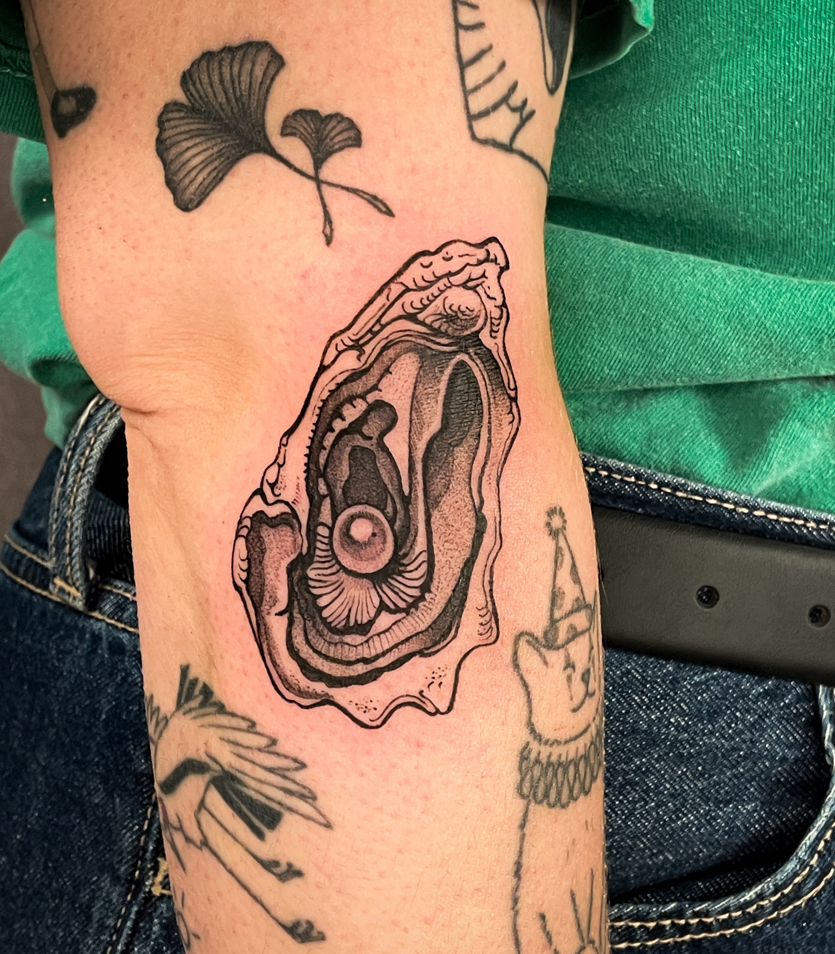 Oyster shell black and grey tattoo on the forearm by 𝖂𝖍𝖆𝖙𝕽𝖊𝖎𝖑𝖊𝖞