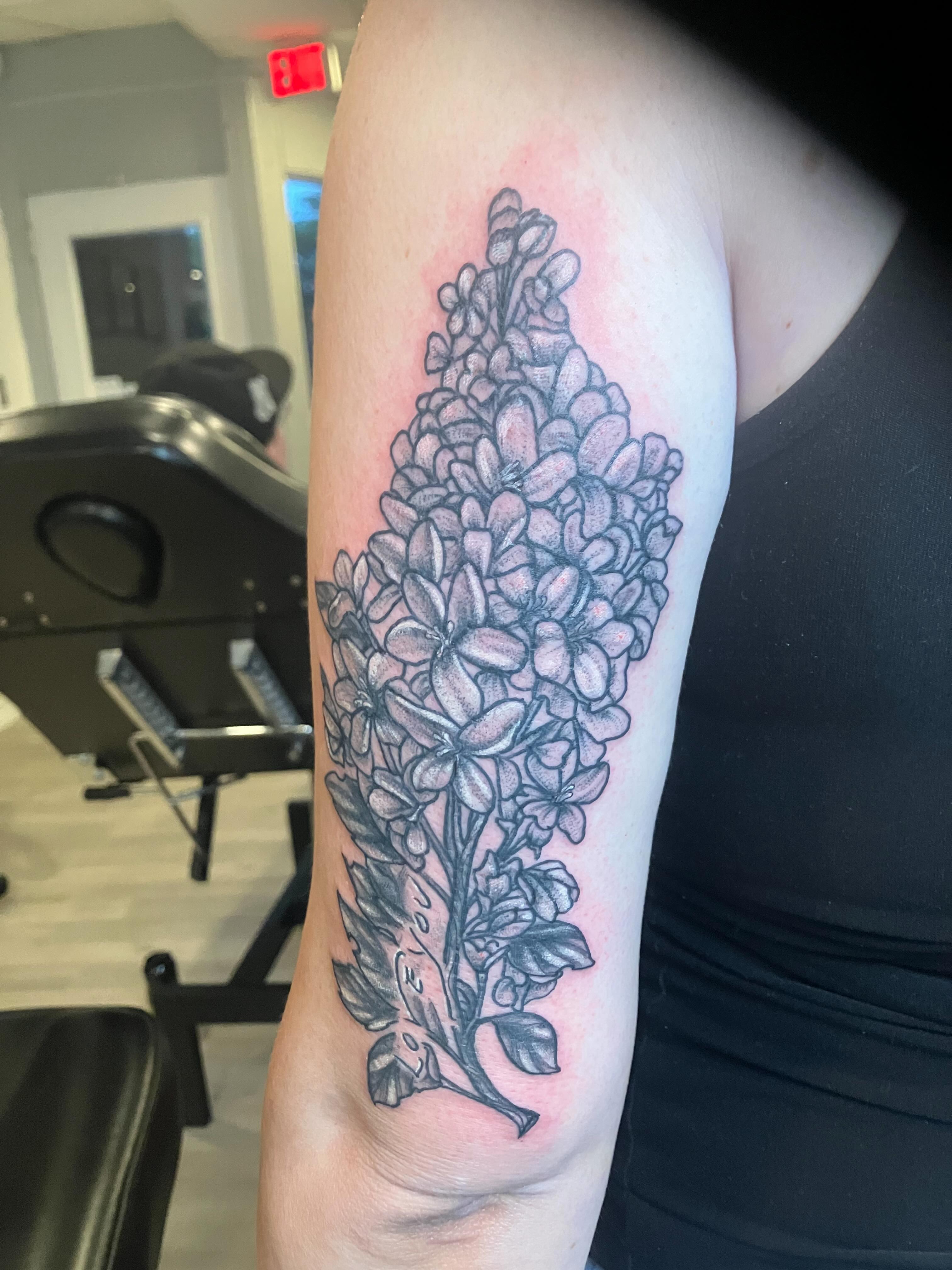 Lilac flowers black and grey tattoo on the forearm by Madeline, Akron, Ohio