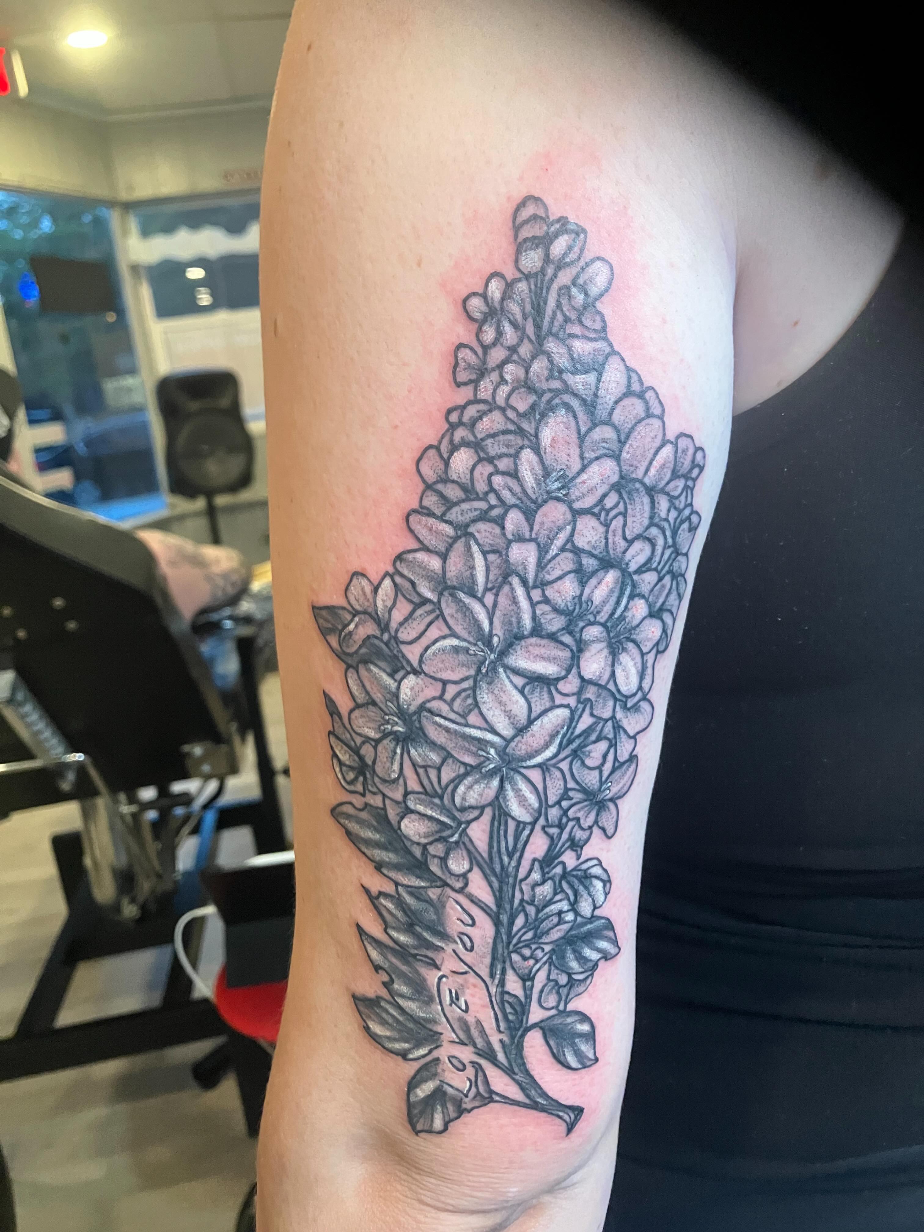 Lilac flowers black and grey tattoo on the forearm by Madeline, Akron, Ohio