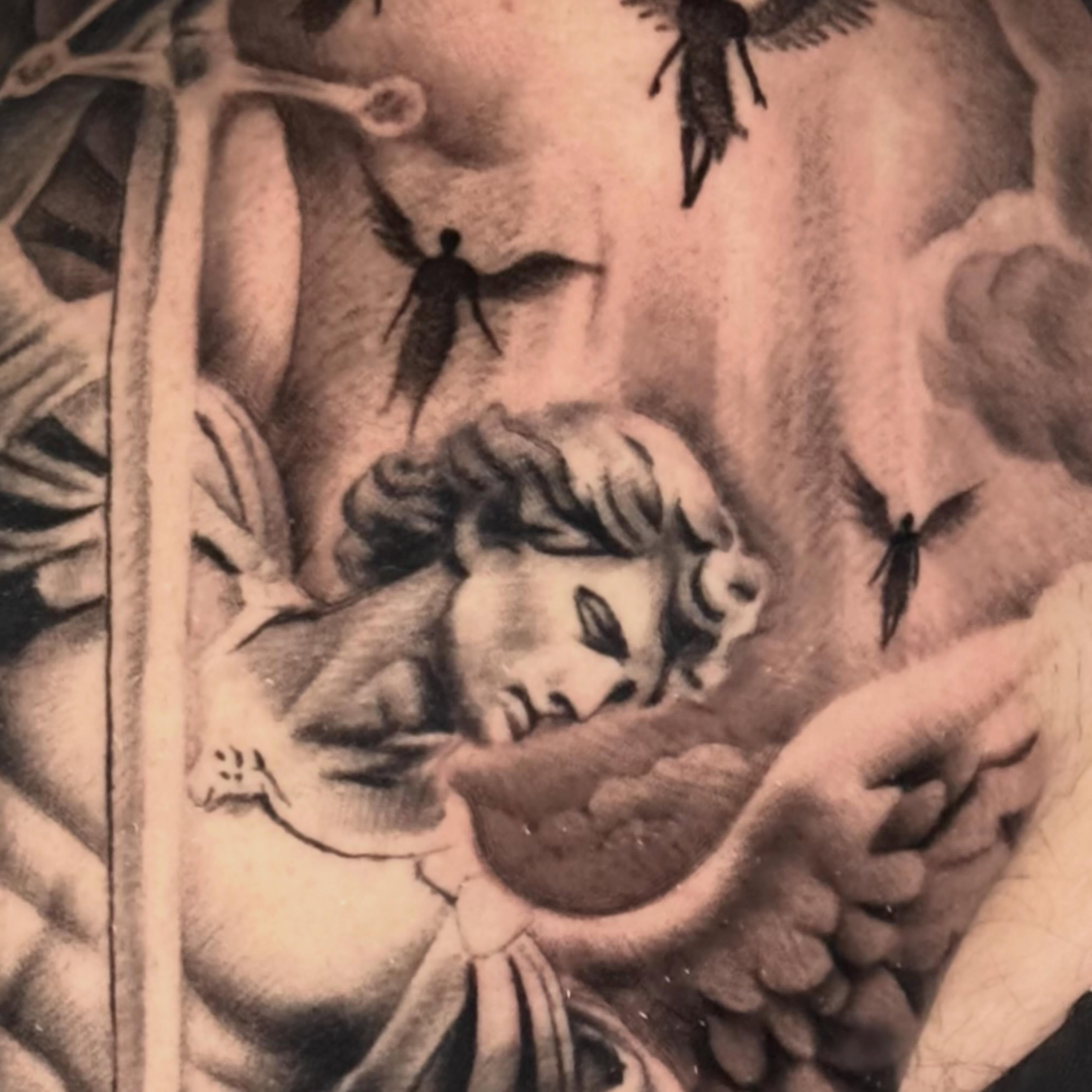 Angels and cherubs realism tattoo on the torso by Tony Garcia