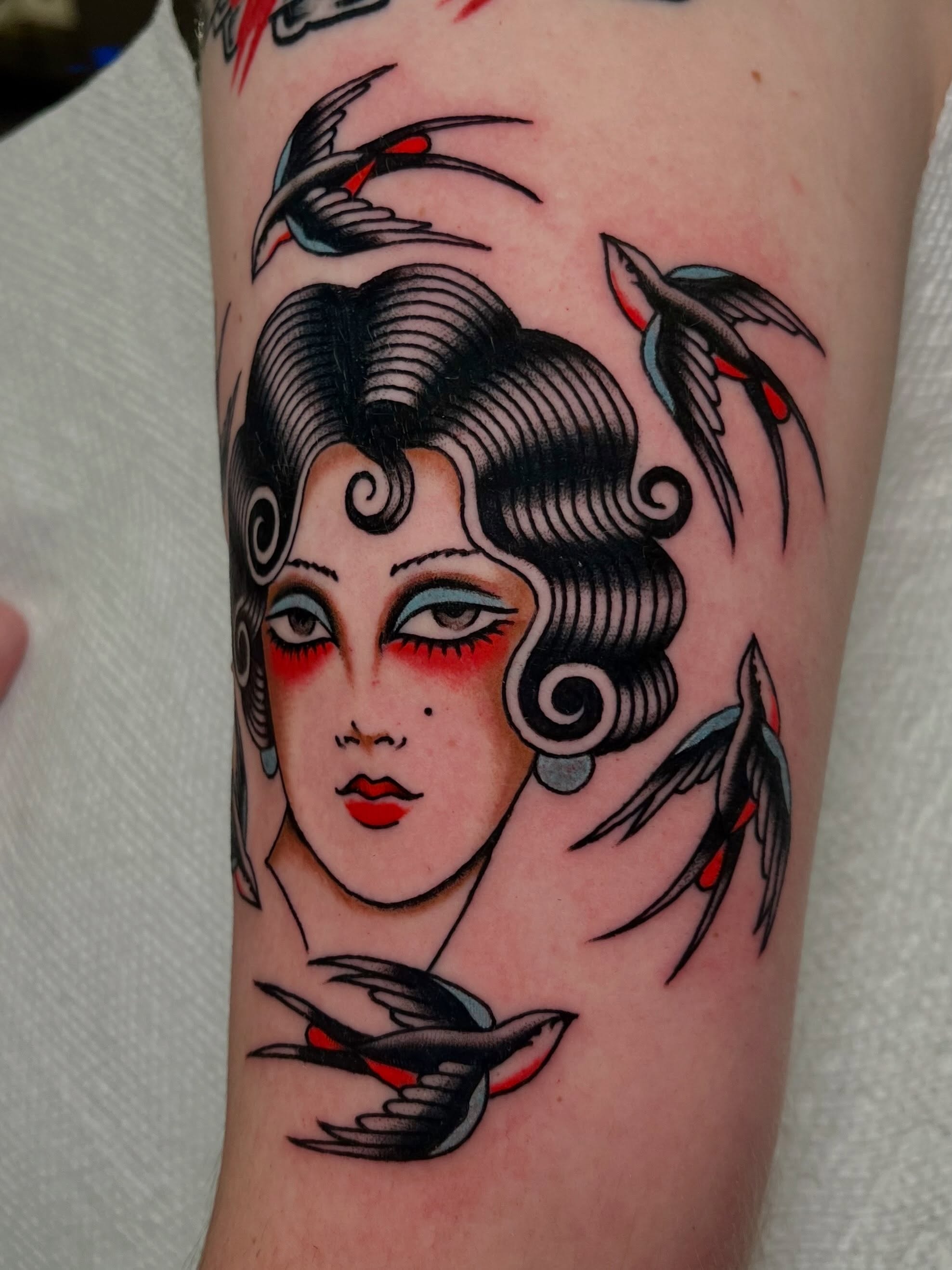 Woman with birds American traditional tattoo on the forearm by Liv :)