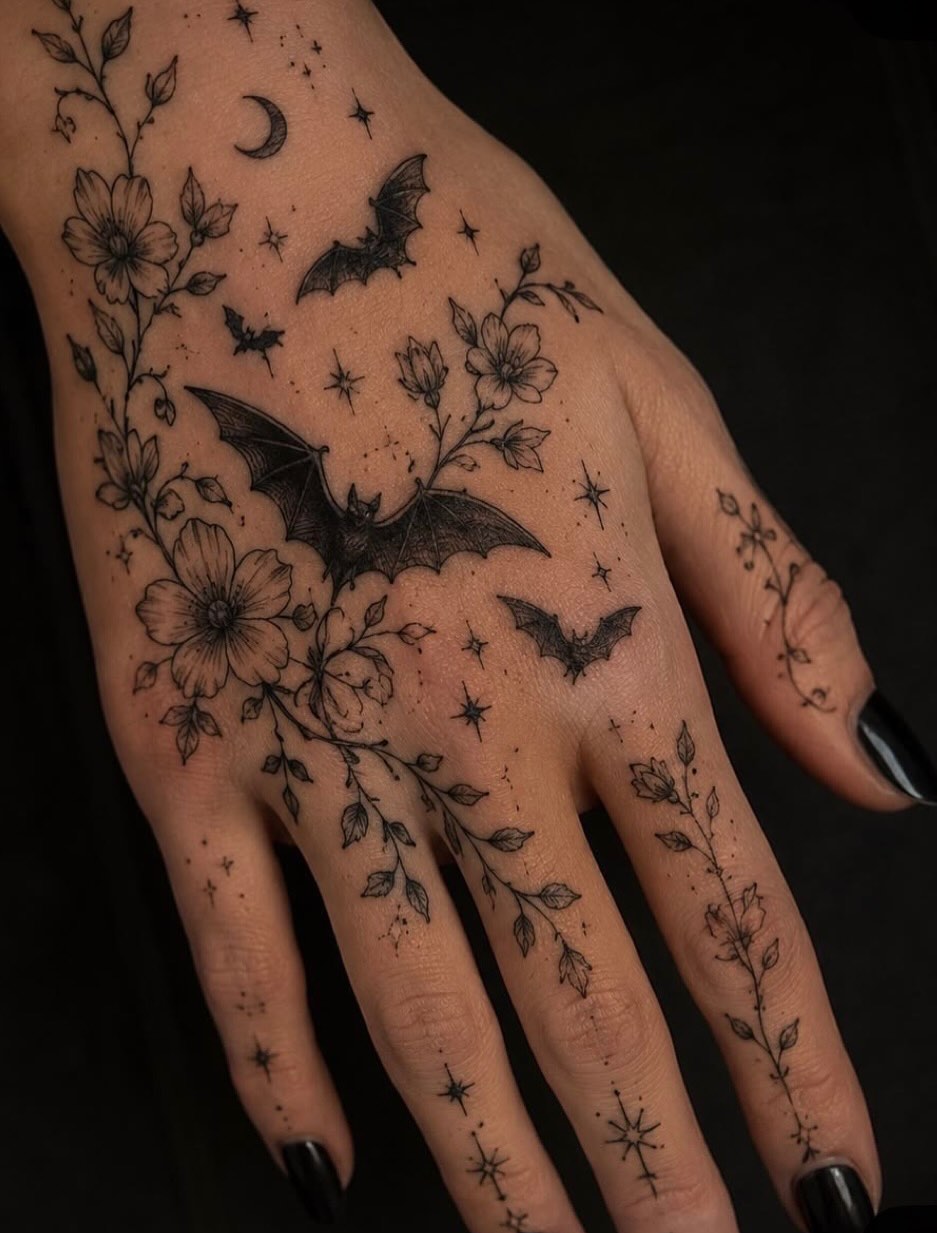 Floral bat night sky fine line tattoo on the hand by Jazz Walker