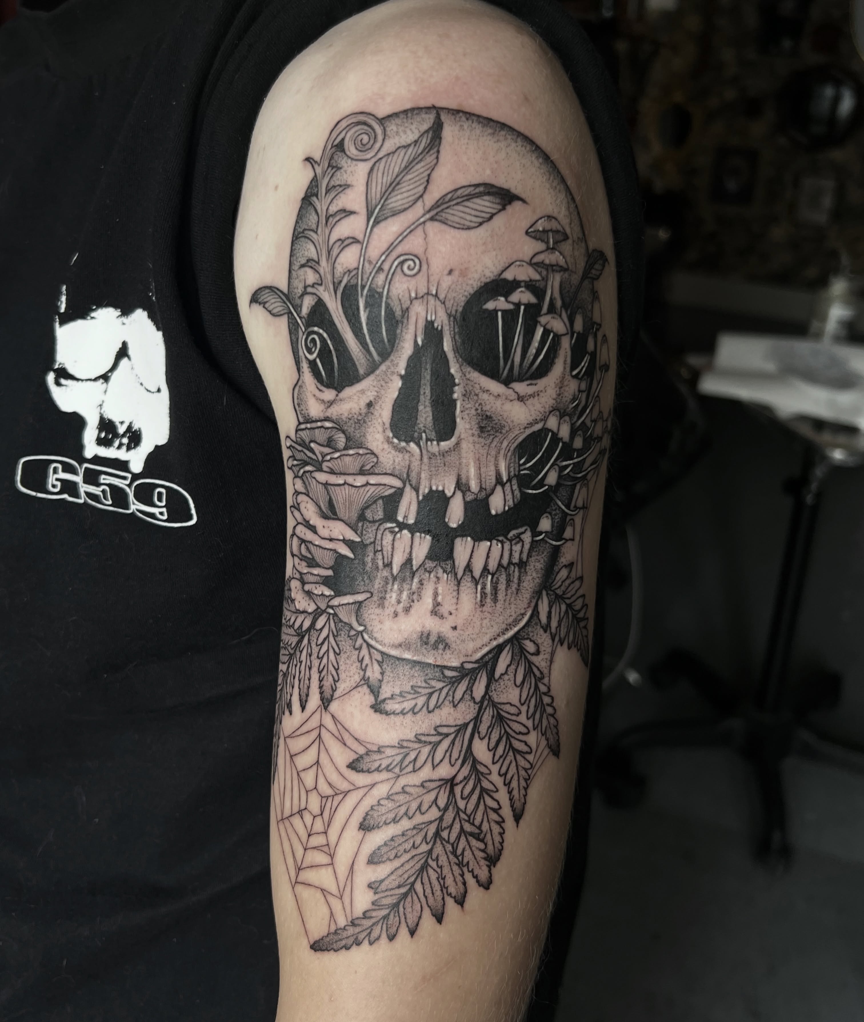 Skull with flora dotwork tattoo on the forearm by ✶ H A N N A H K A y ✶
