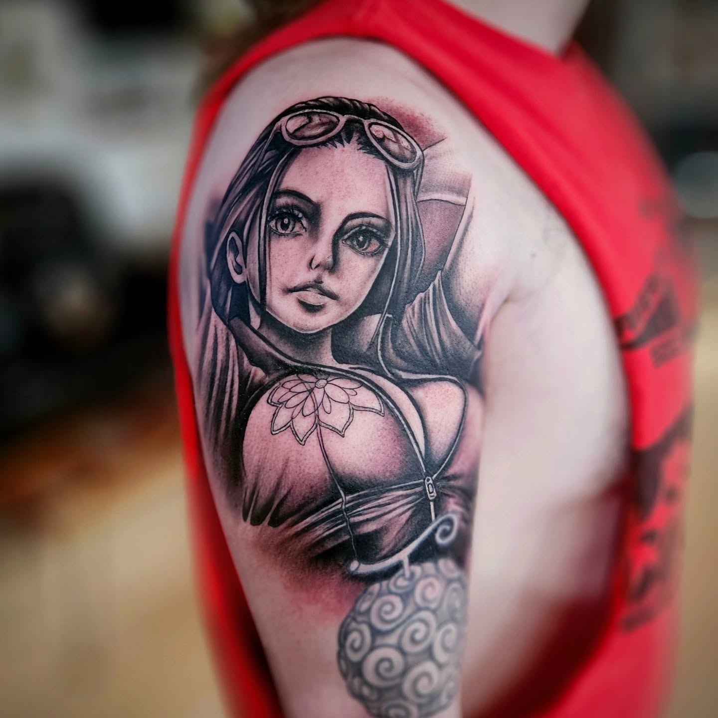Woman with goggles realism tattoo on the shoulder by Justin J-rust Smith