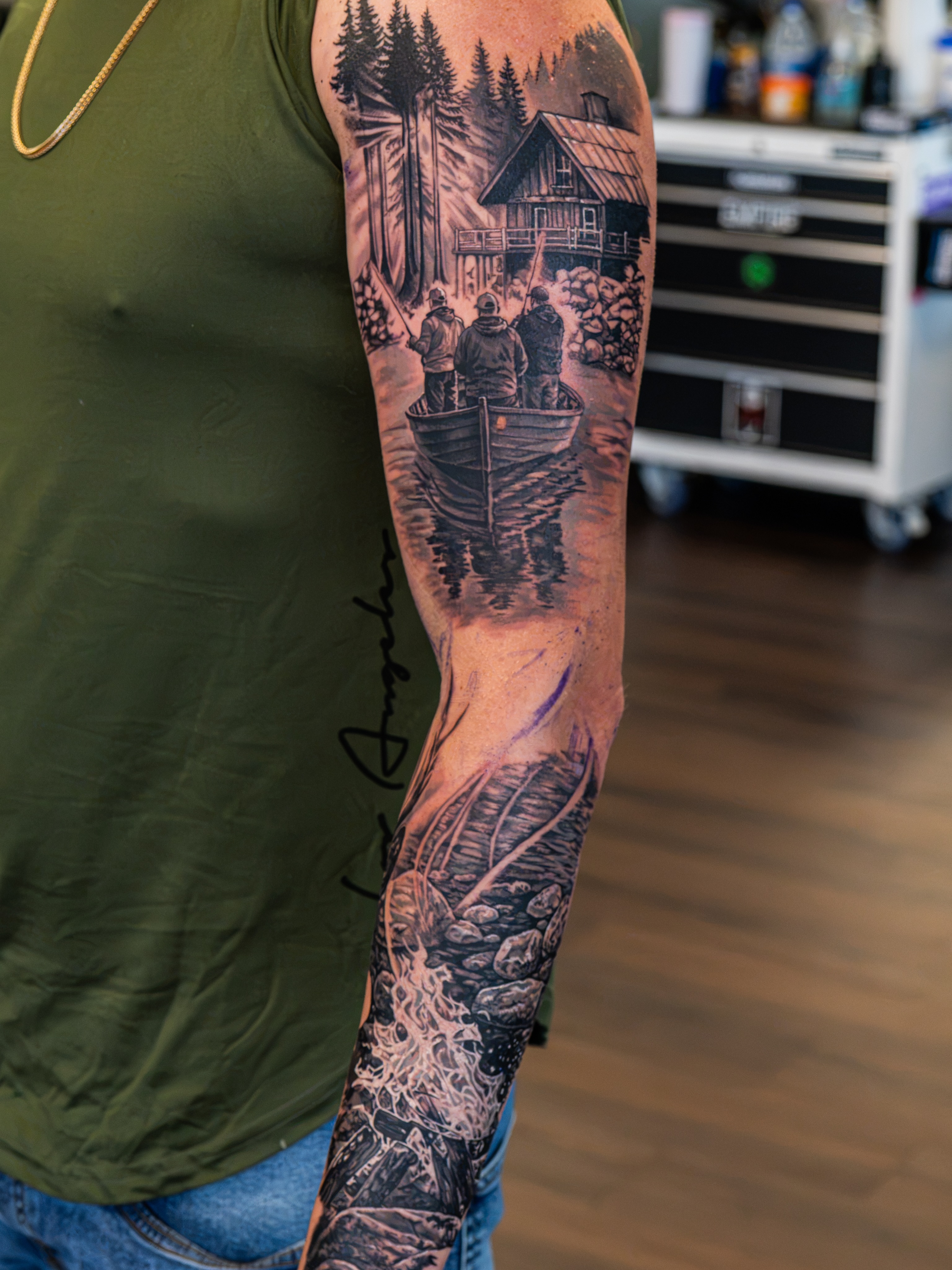 Forest cabin scene realism tattoo on the forearm by Simon Pouliot