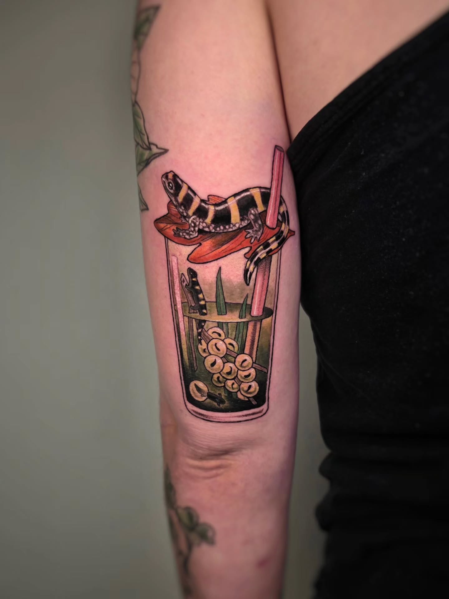 Snake in drink American traditional tattoo on the forearm by Whitney Caskey
