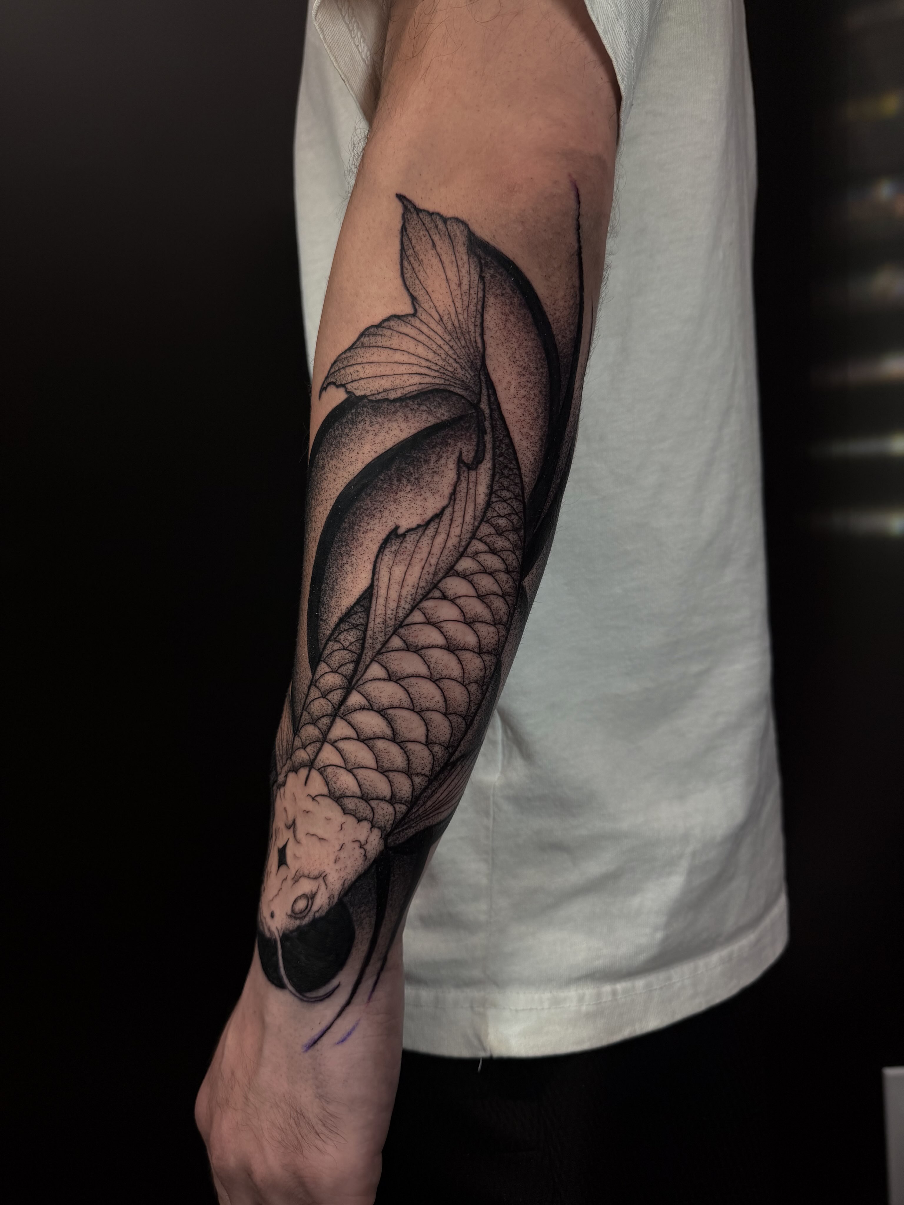 Koi fish dotwork tattoo on the forearm by Sebastián Vallejo