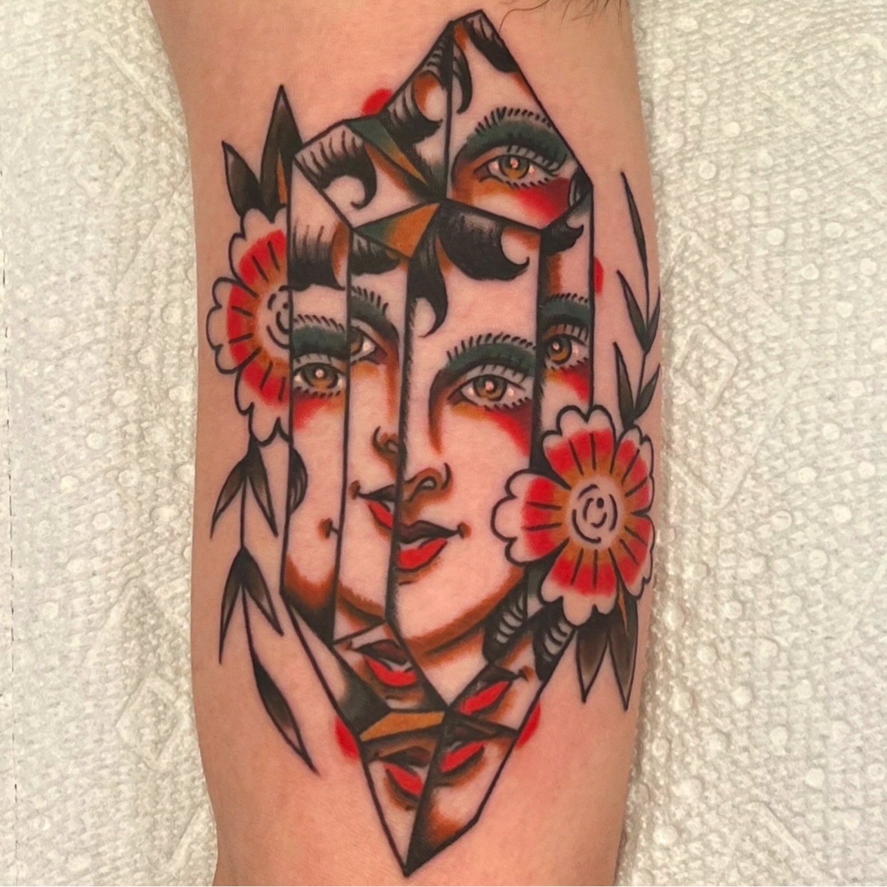 Geometric portrait American traditional tattoo on the forearm by @brandonhuckabey, Denver, Colorado