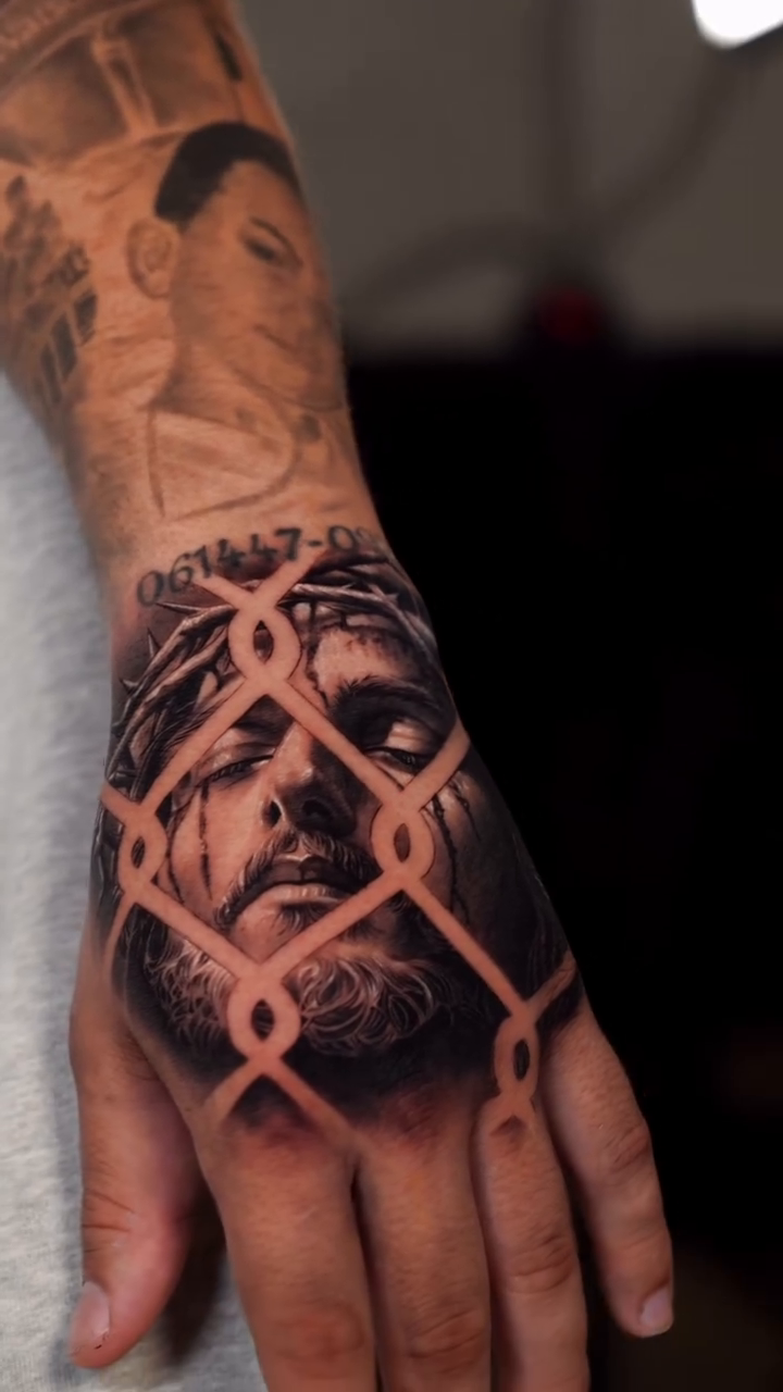 Face behind a fence realism tattoo by J O S S I e L P I N e D A