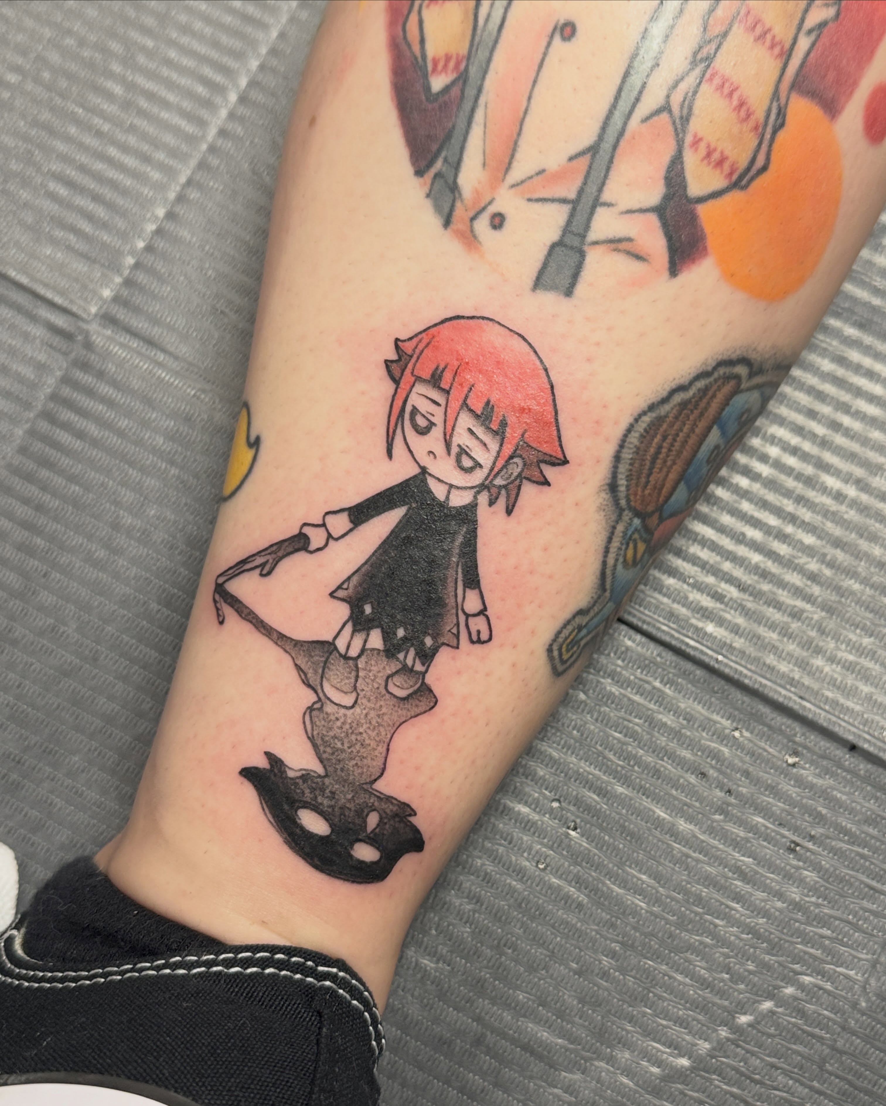 Anime character anime tattoo on the forearm by Rebecca Rose