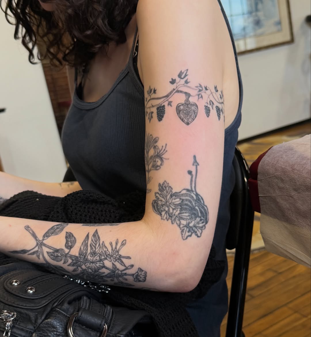 Botanical black and grey tattoo on the forearm by Sienna (jj) Hicks
