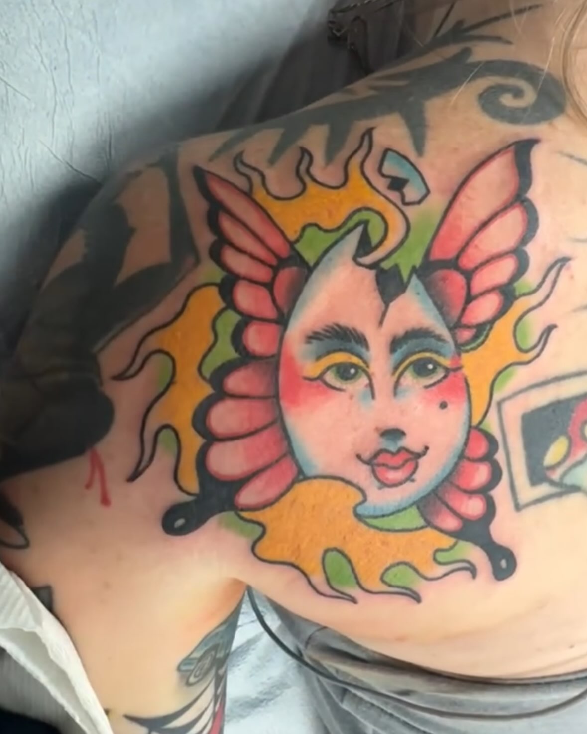 Woman's face American traditional tattoo on the shoulder by Kyle Simmons