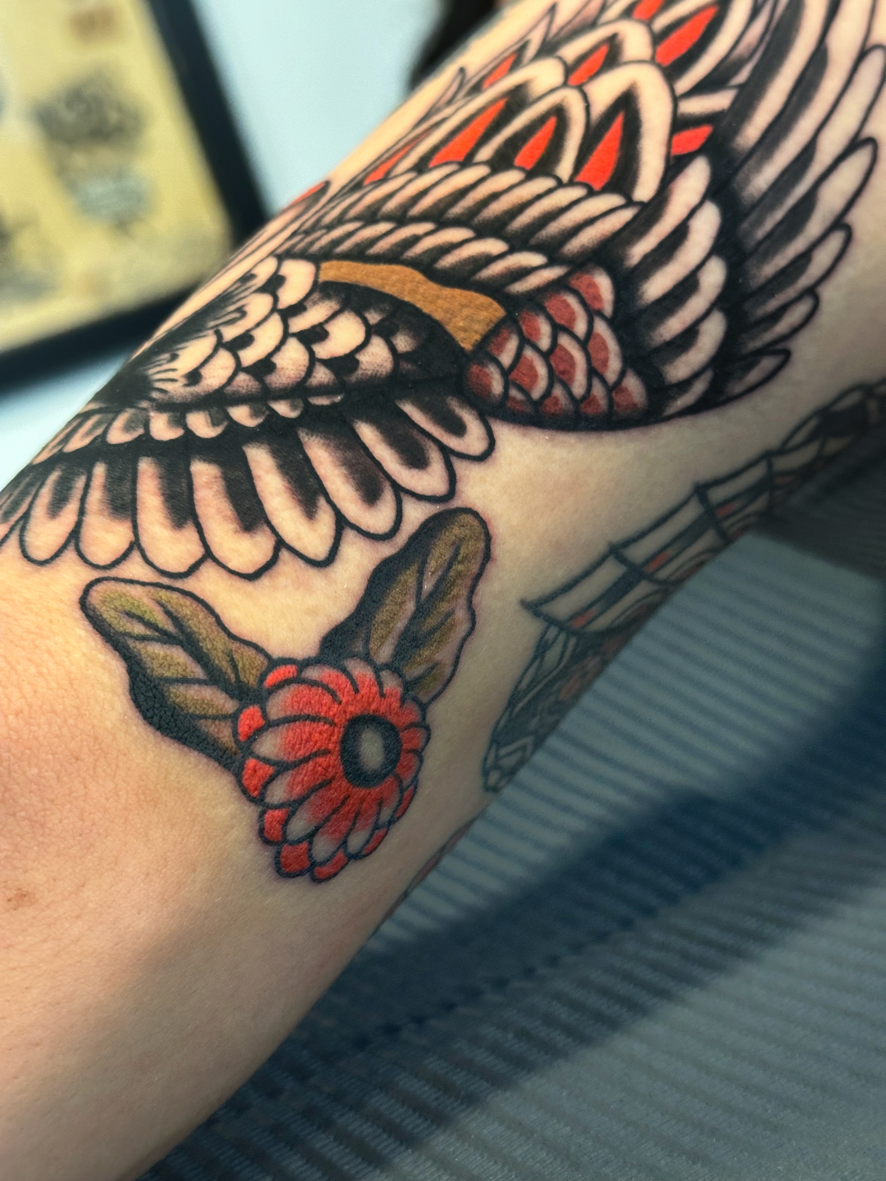 Wings and flower American traditional tattoo on the forearm by A.j. Lingerfeldt, Nashville, Tennessee