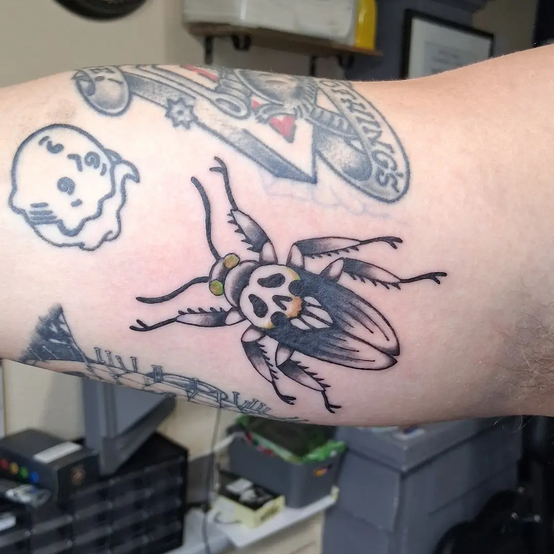 Fly black and grey tattoo on the forearm by Tanya Tattoota