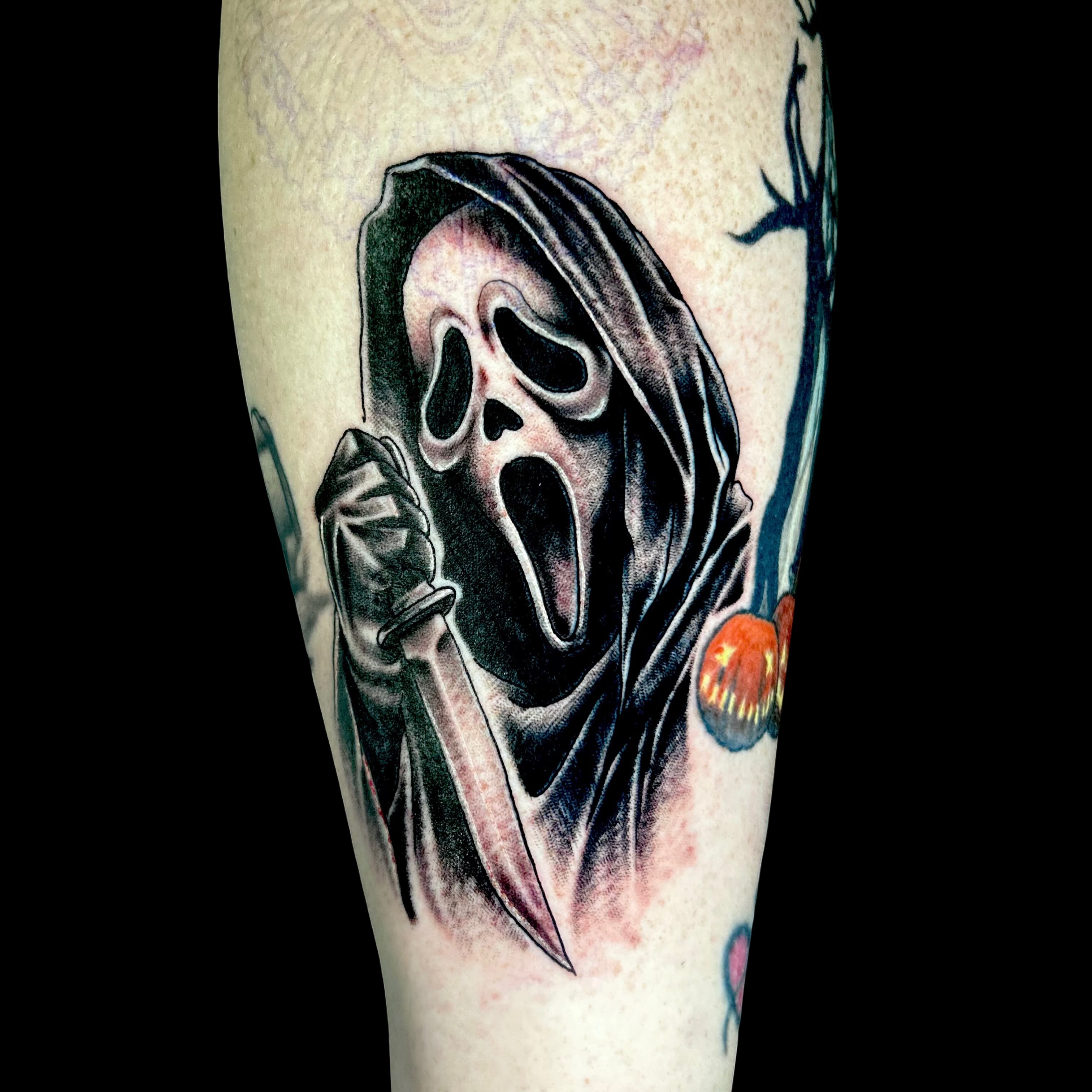 Scream mask dark realism tattoo on the forearm by Austin Young